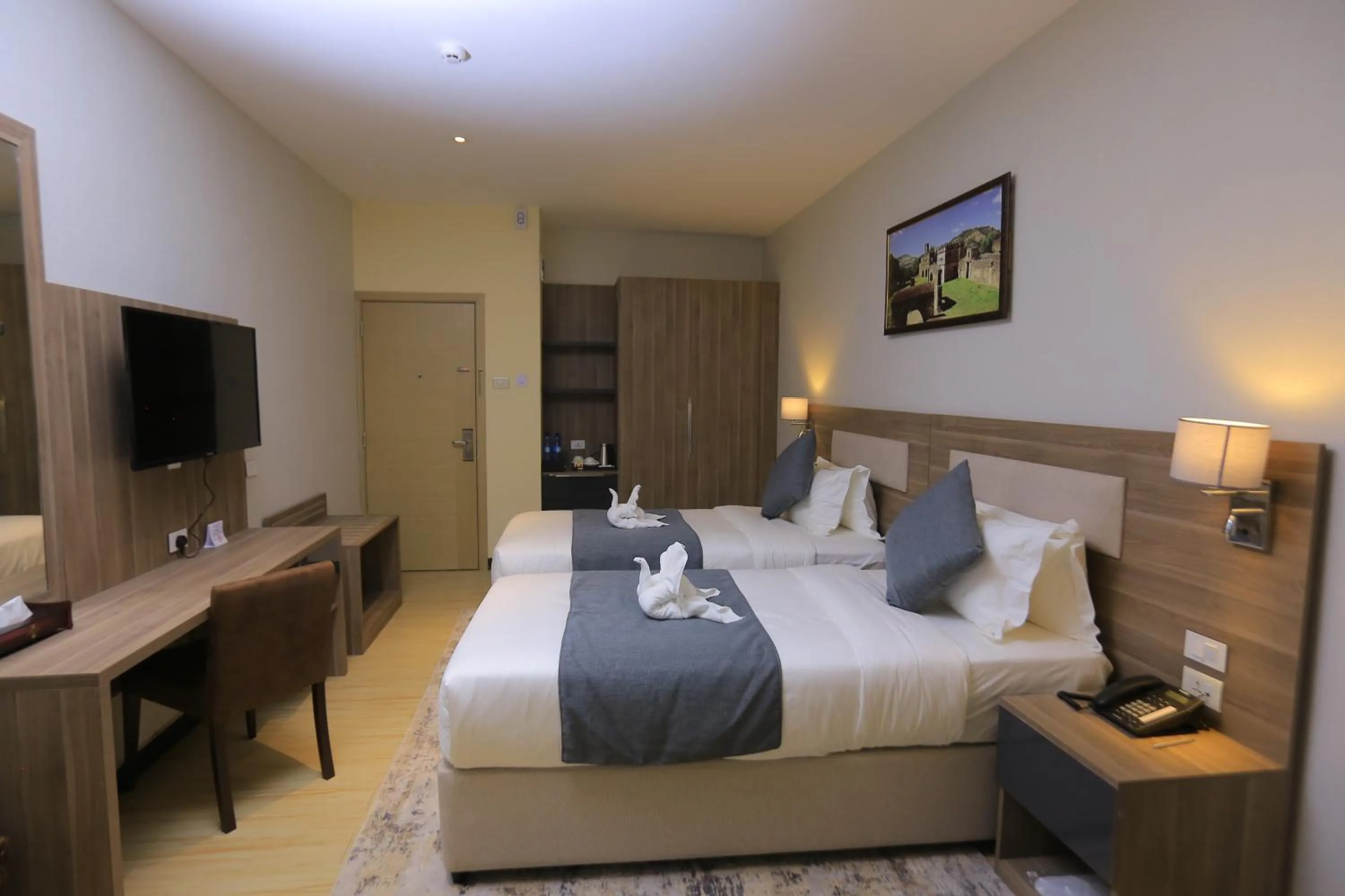 Bed in Triple E Hotel and Spa