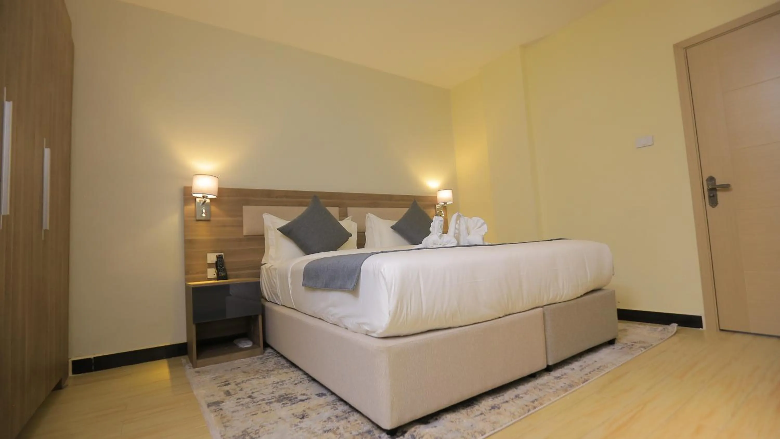 Bed in Triple E Hotel and Spa