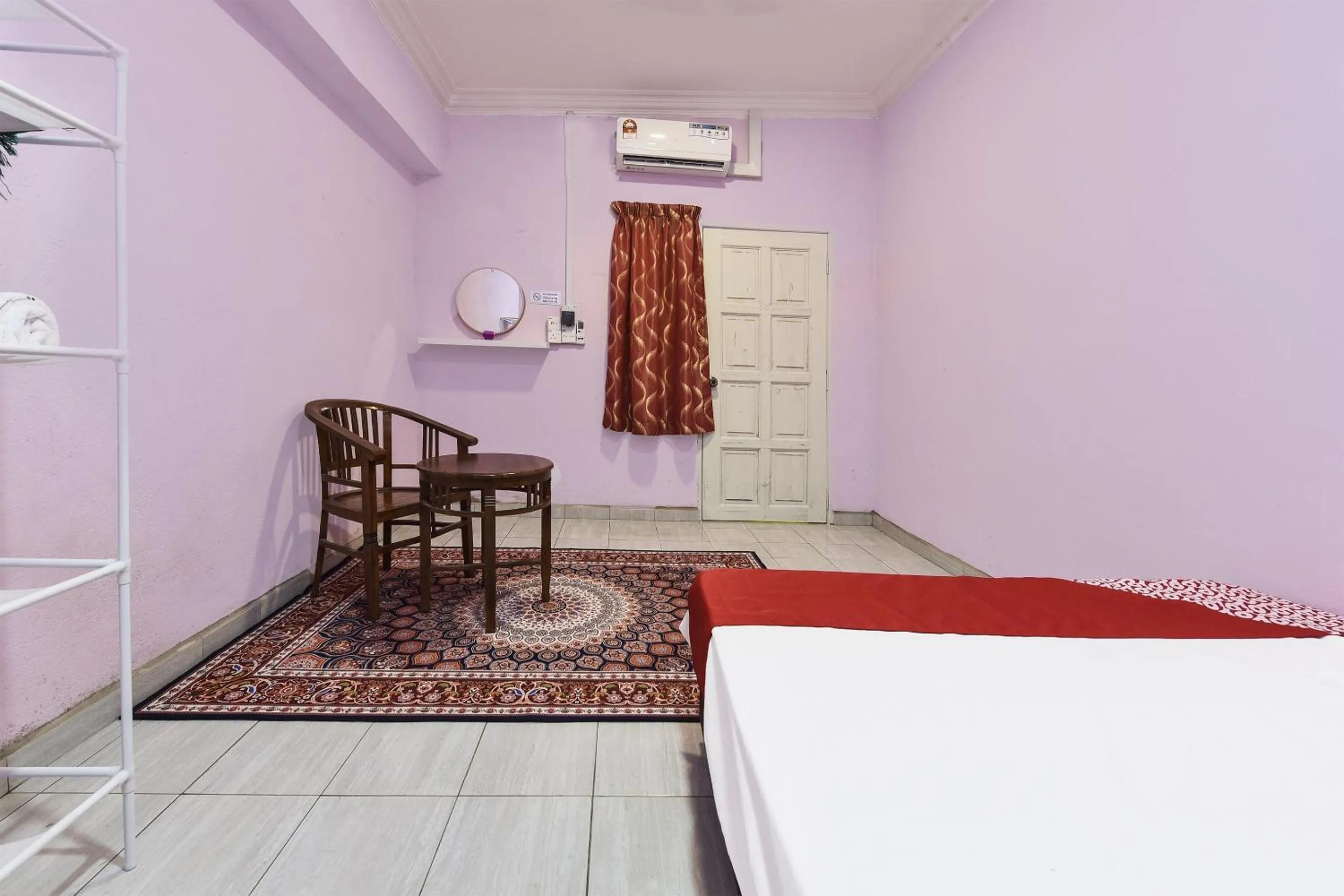 Bedroom, Bed in Hotel O Zn Mix Homestay & Roomstay