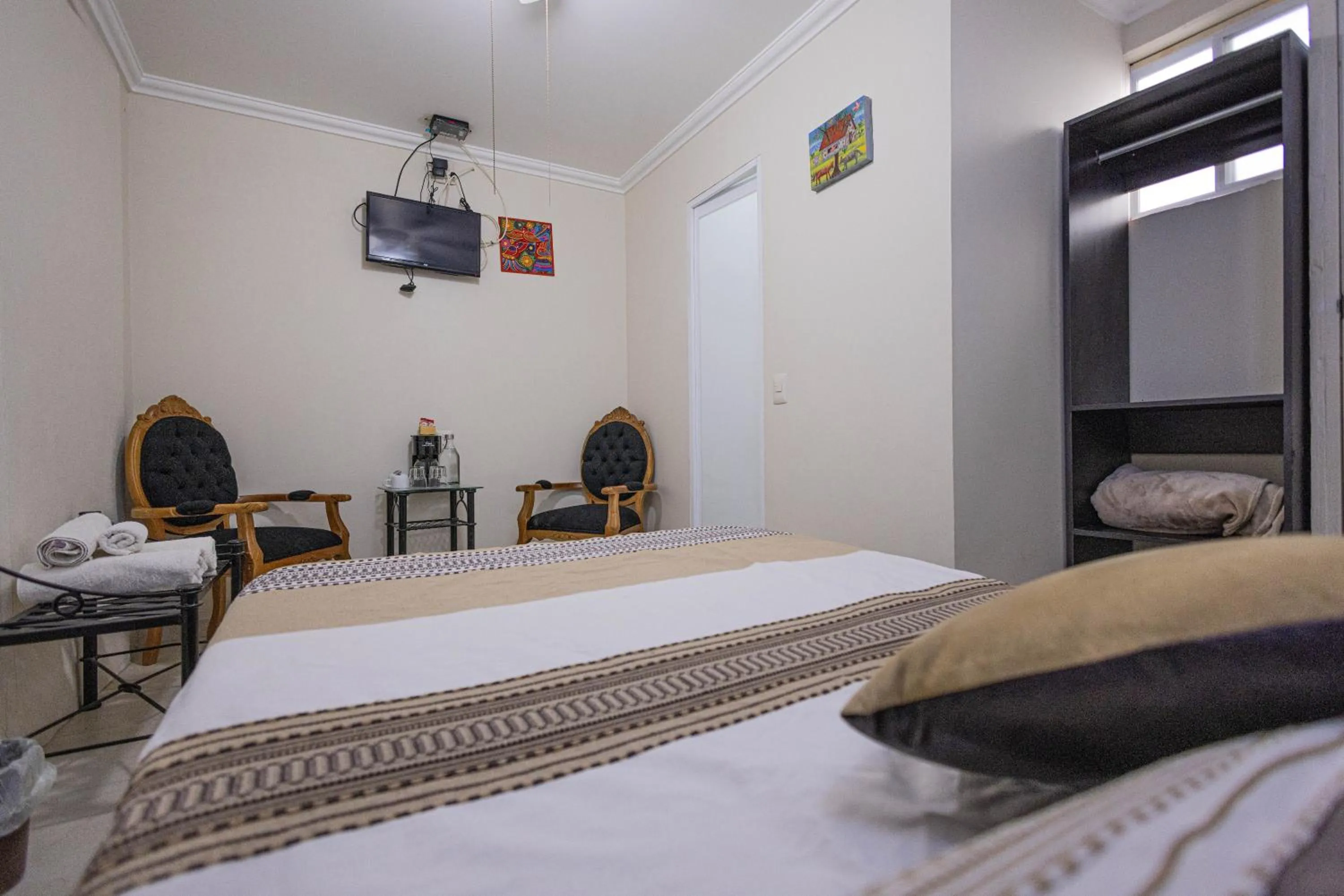 Bedroom, Bed in Capital O Hotel Patio Pombo