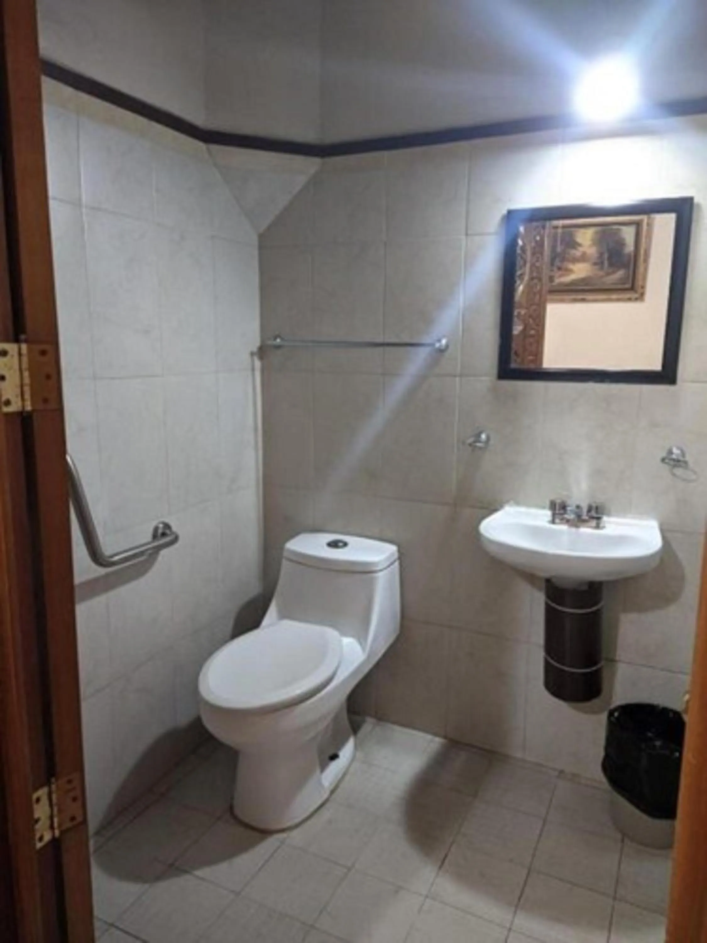 Bathroom in Capital O Hotel Patio Pombo