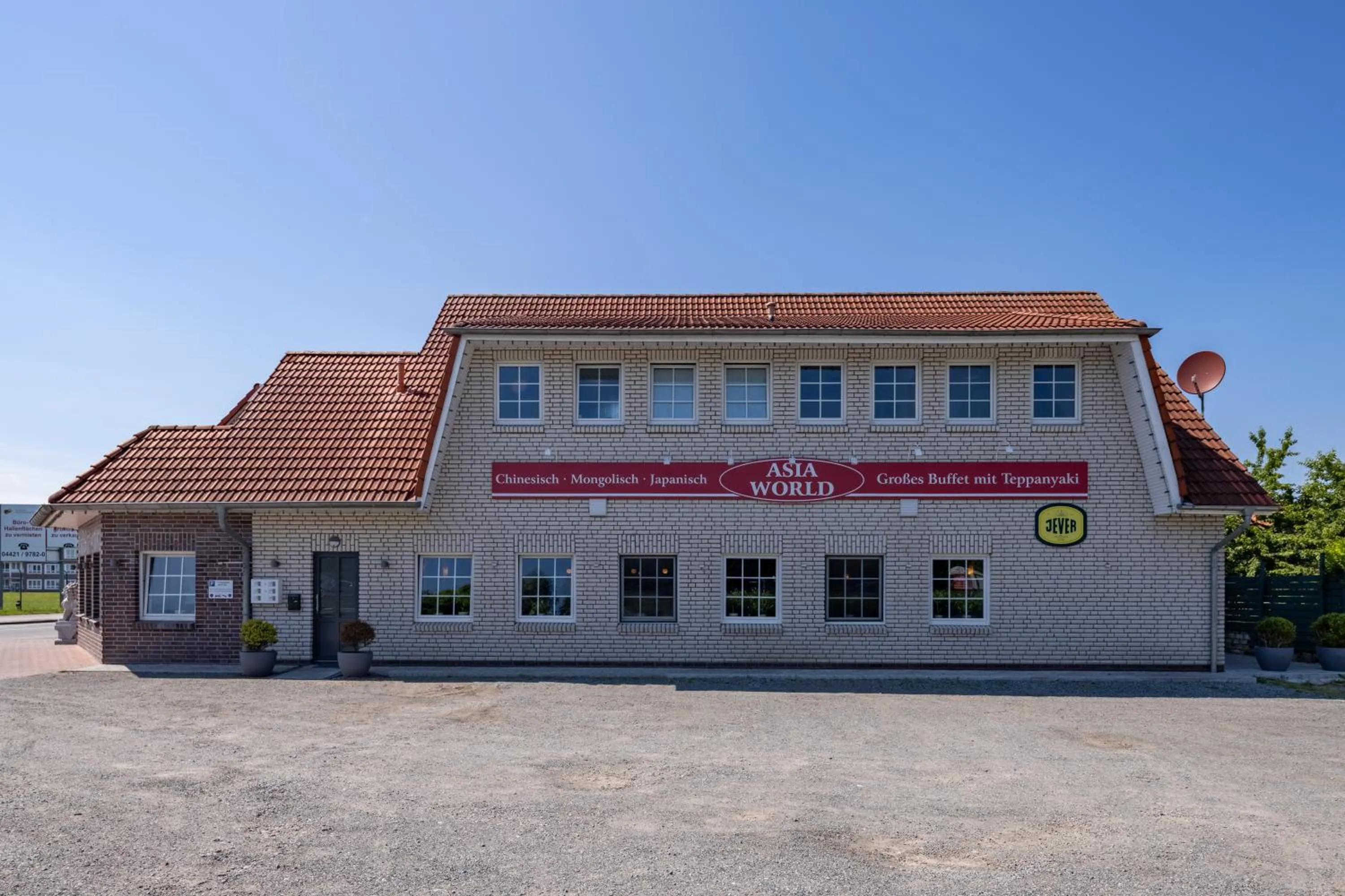 Property building in Gästehaus Olympia Wilhelmshaven - Moderne Einzelzimmer mit eigenem Bad für Monteure