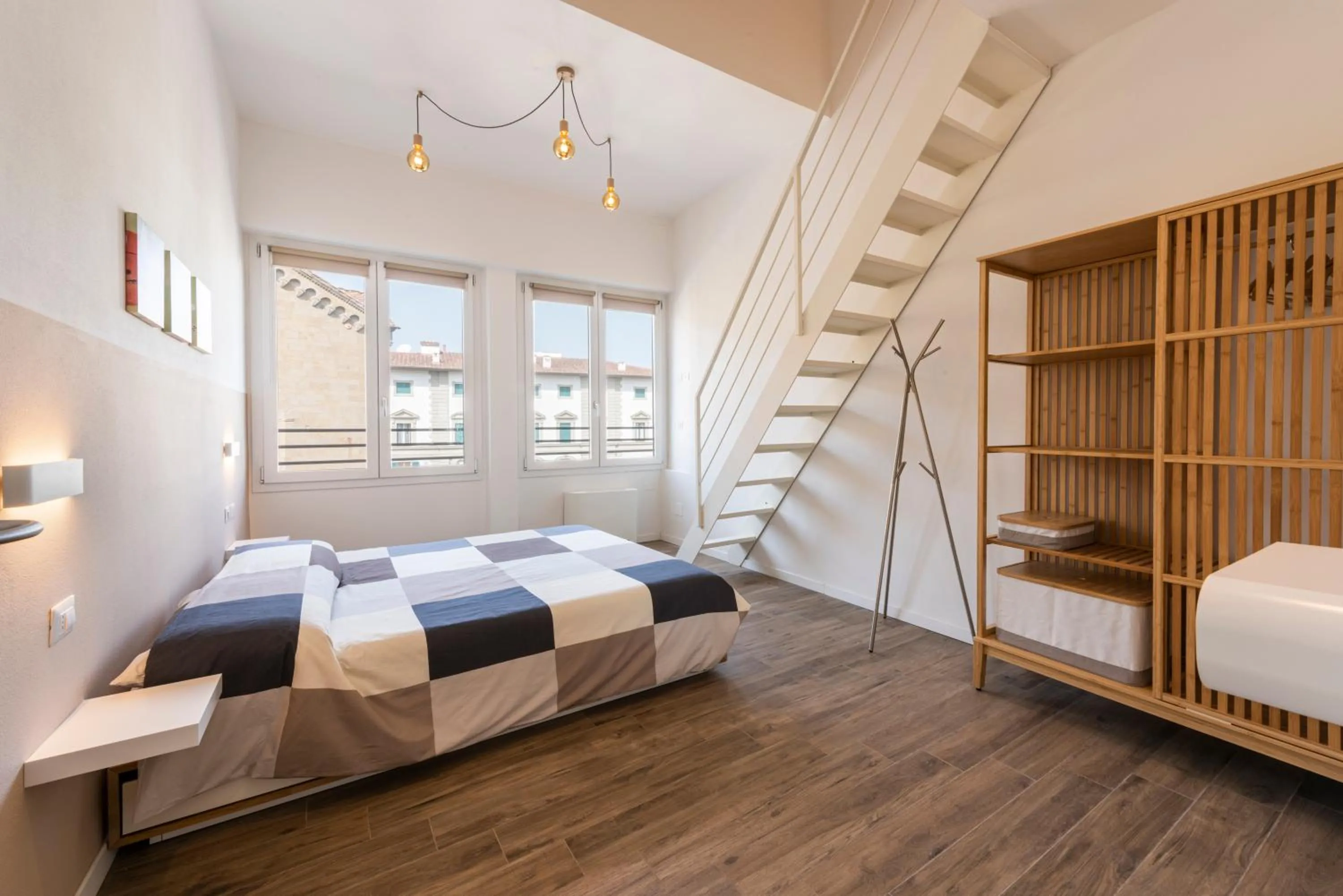 Bed in Ruote Stylish Loft by Mmega