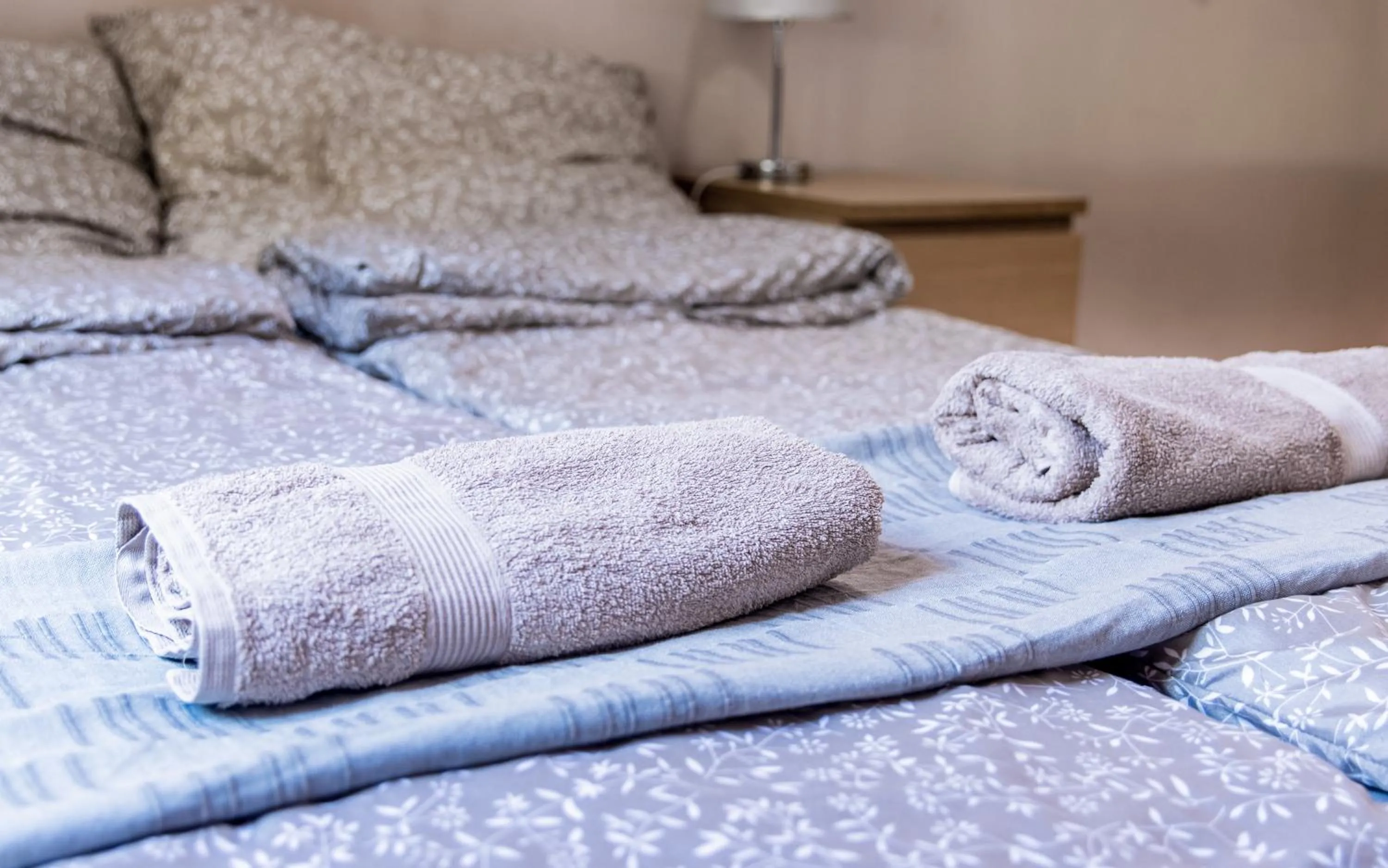 towels, Bed in Aurora Apartments