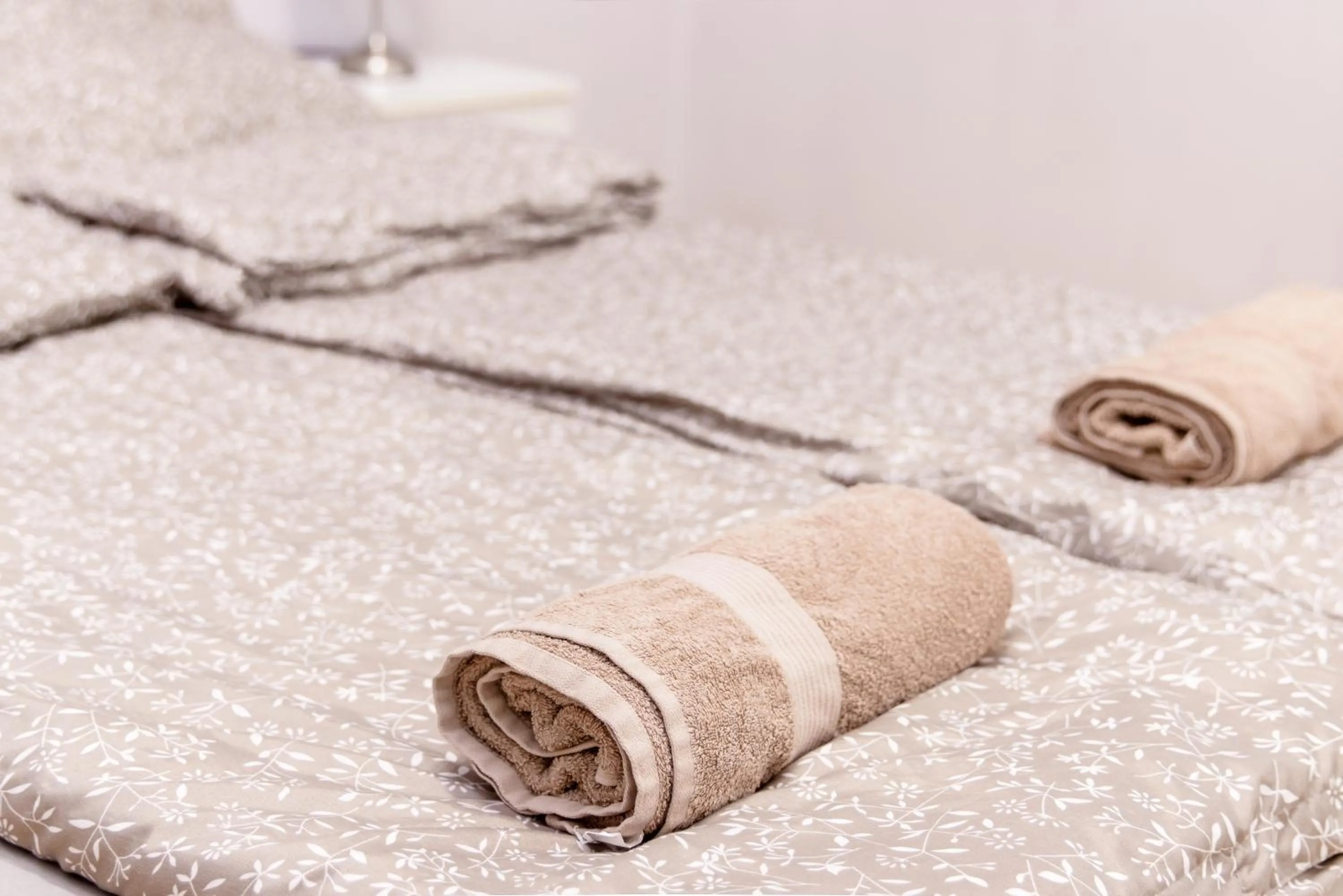 towels, Bed in Aurora Apartments
