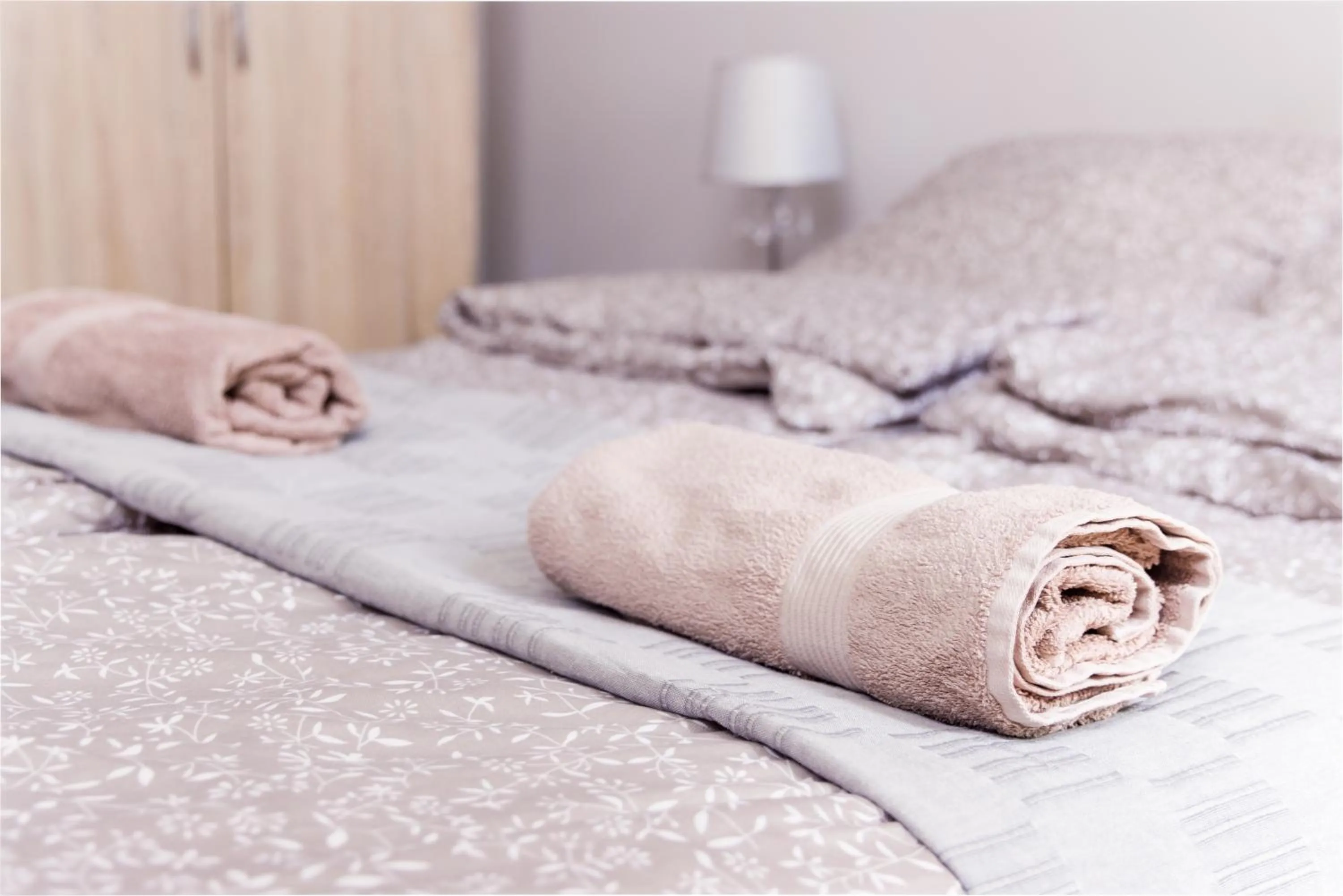 towels, Bed in Aurora Apartments