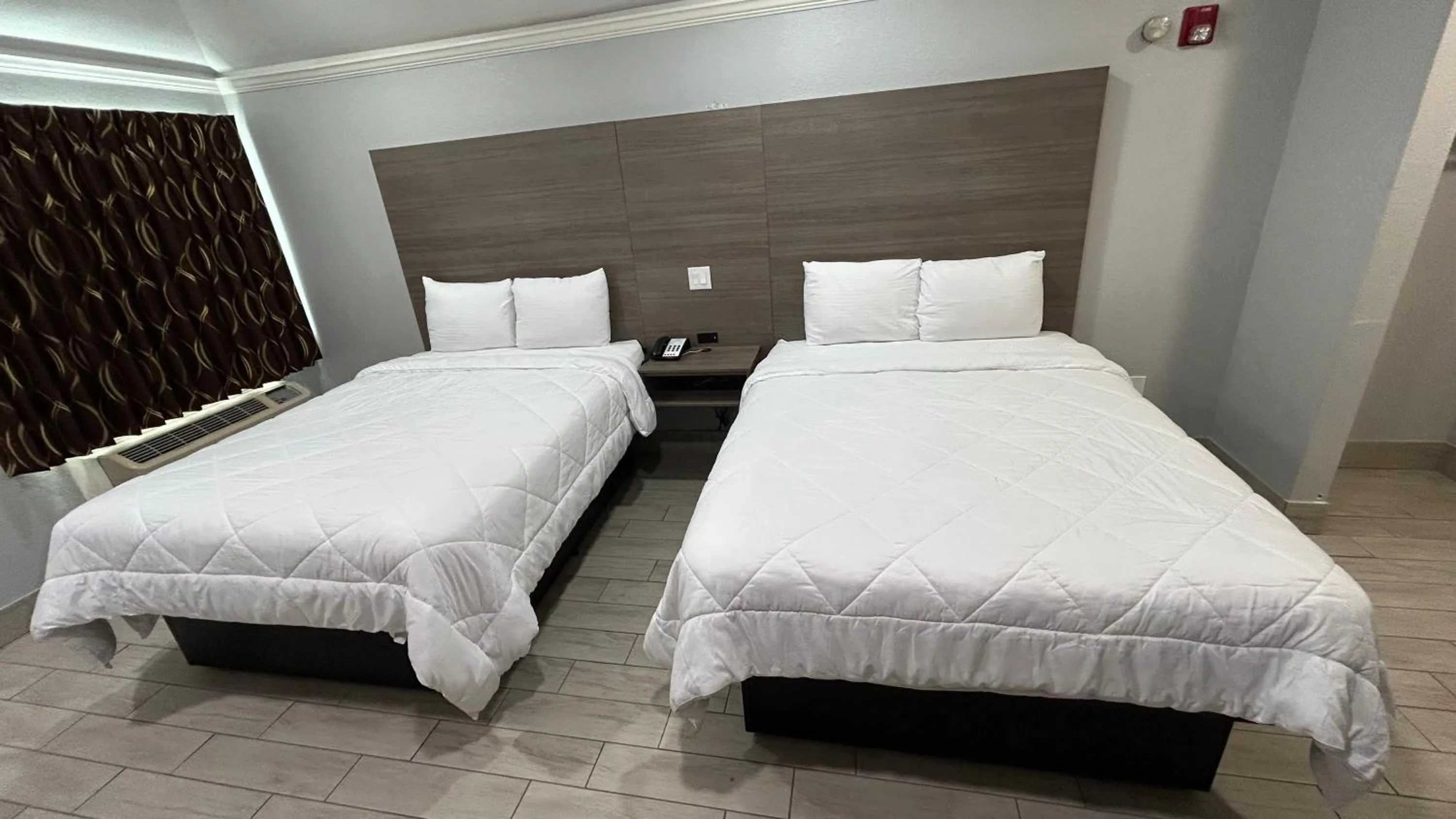 Bedroom, Bed in Kiwi Inn Capital O Houston - Hwy 249