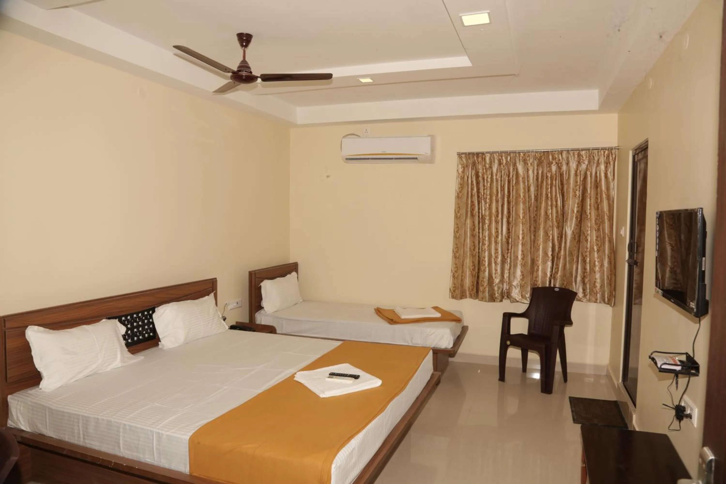 Photo of the whole room, Bed in Santhosh Inn