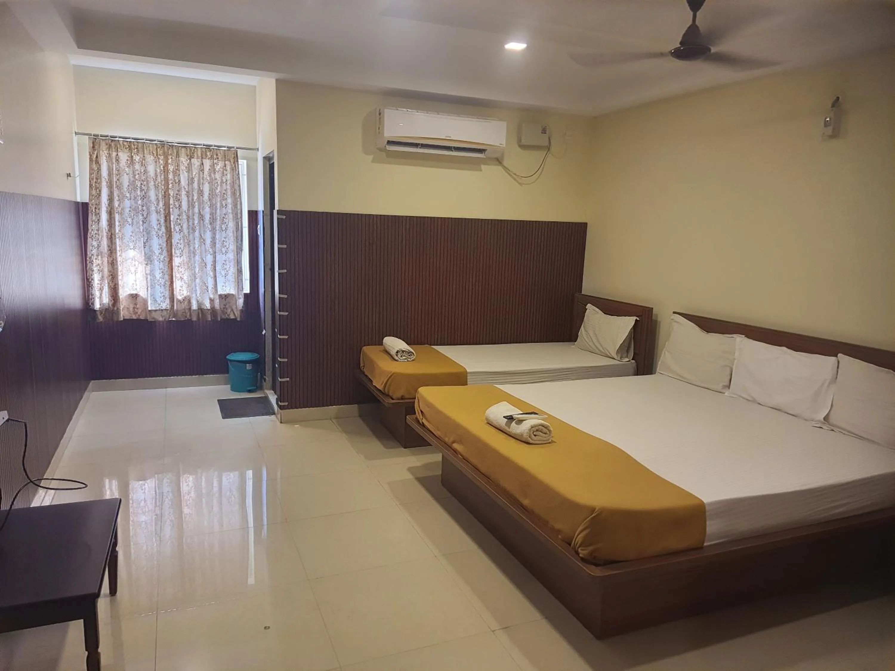 Bed in Santhosh Inn