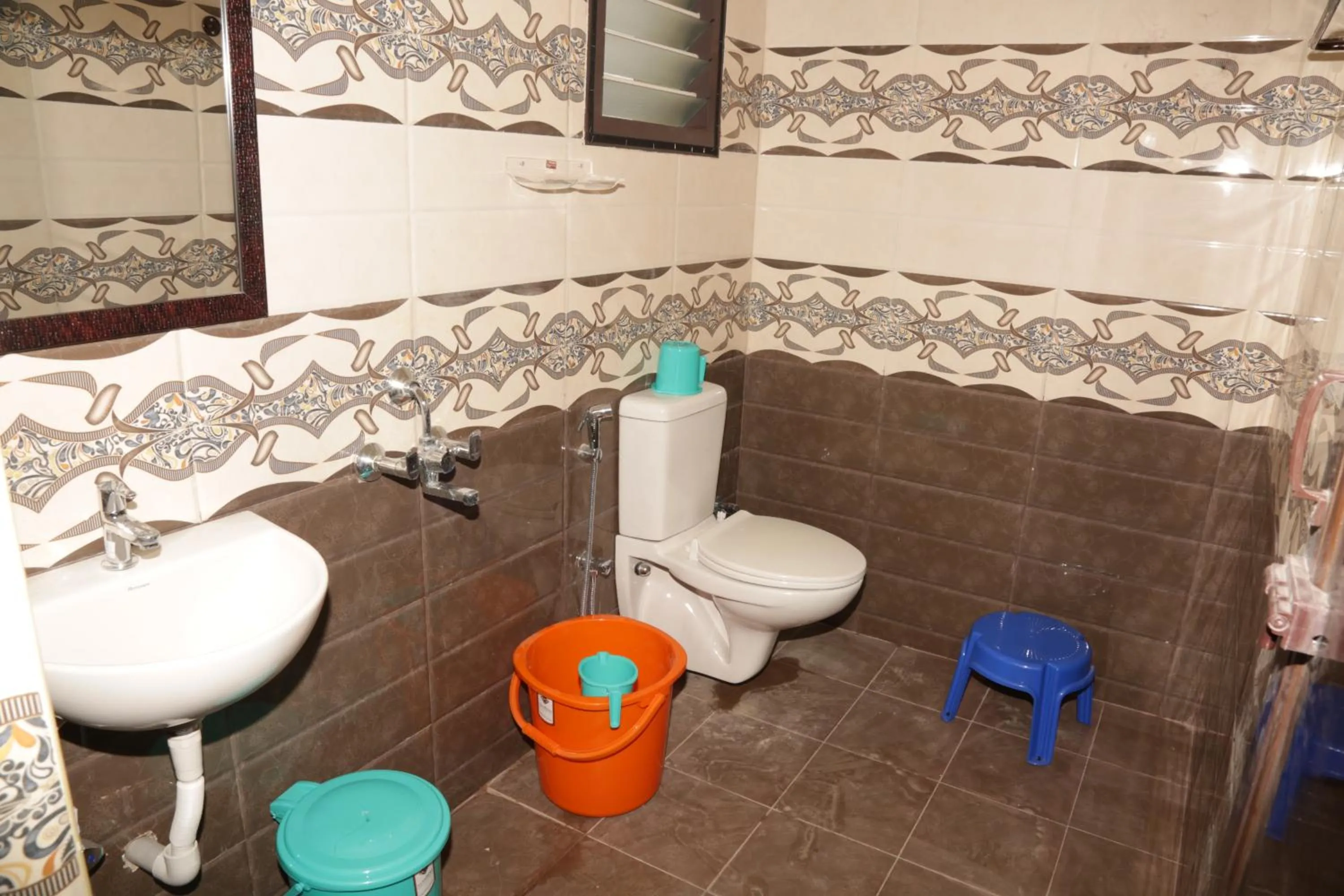 Bathroom in Santhosh Inn