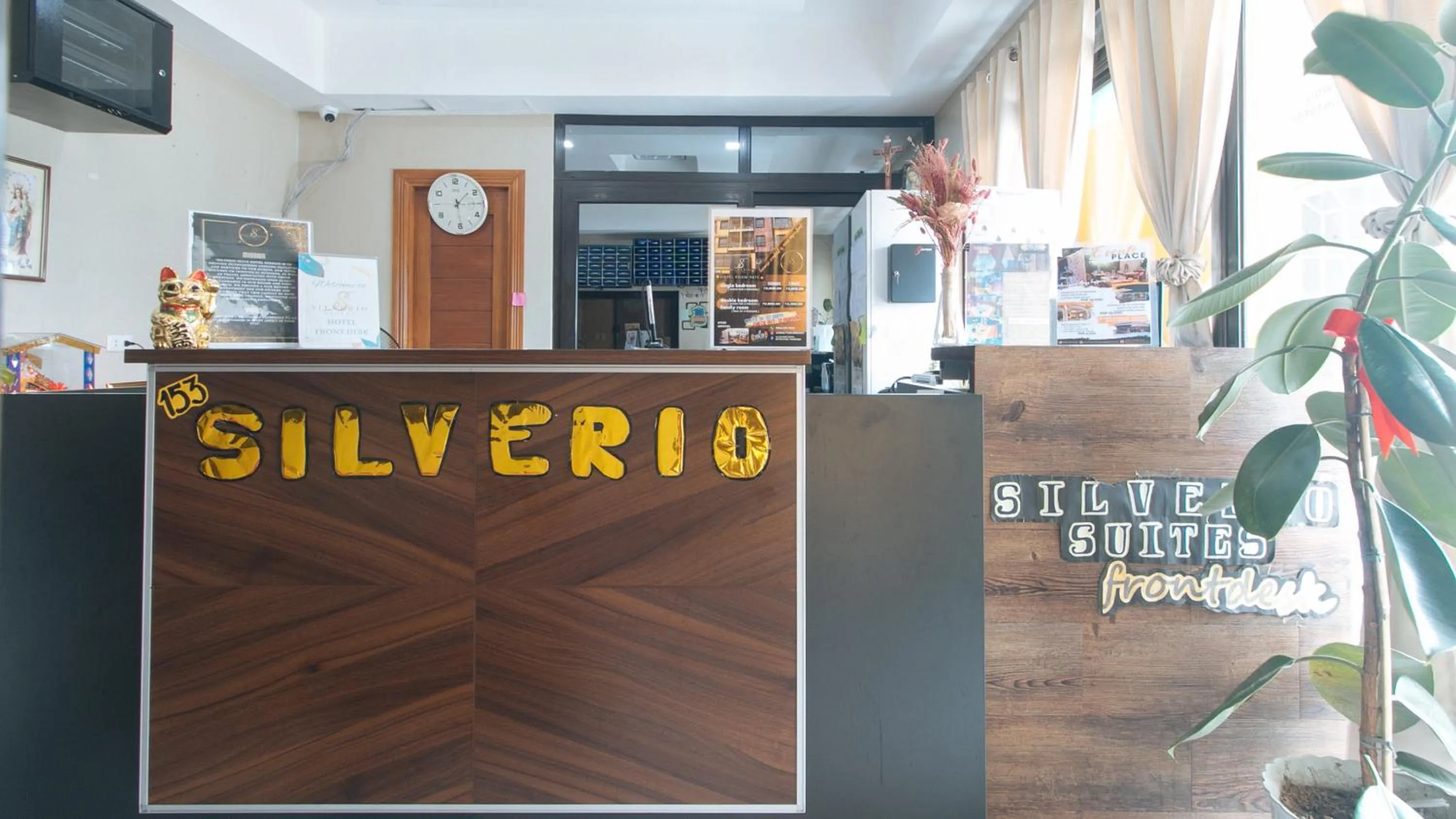 Property logo or sign in 153 Silverio Suites Paranaque City