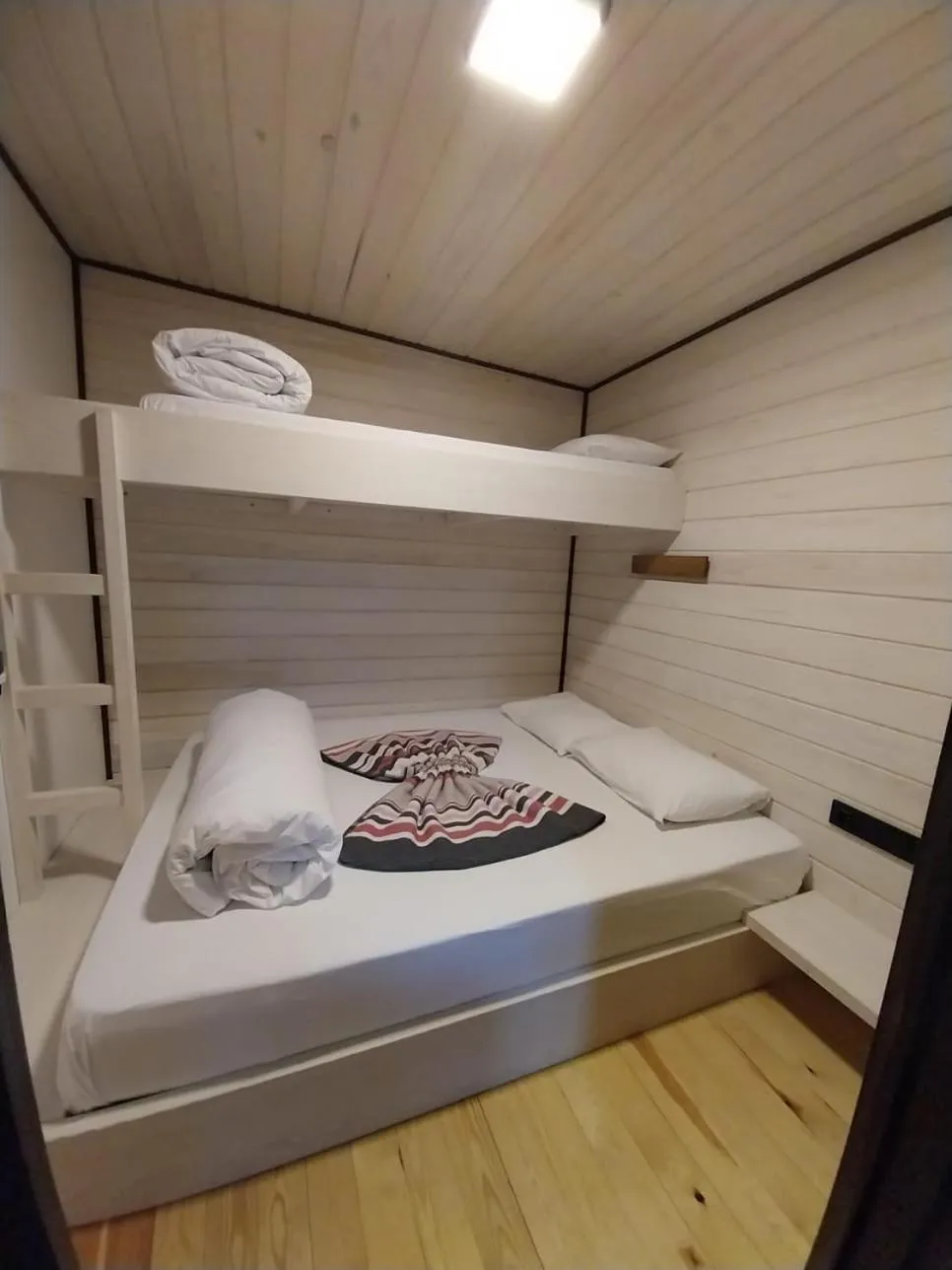 Bed in Danzi camping tiny house