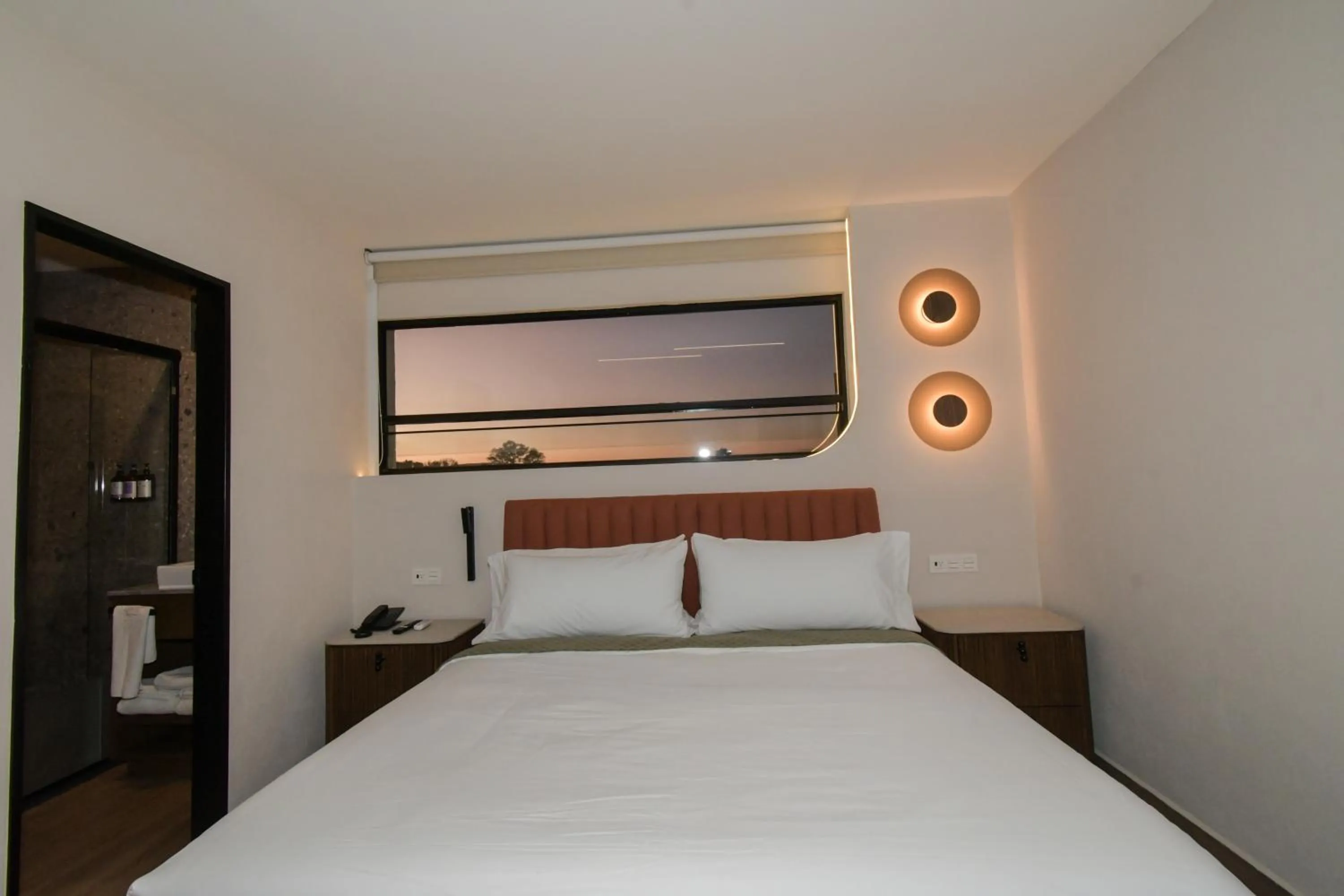 Bed in Expo Satelite 2750 Hotel & Suites