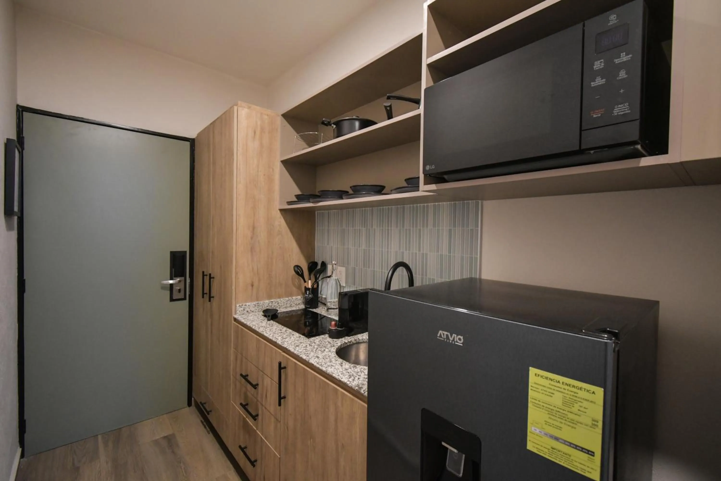 kitchen in Expo Satelite 2750 Hotel & Suites