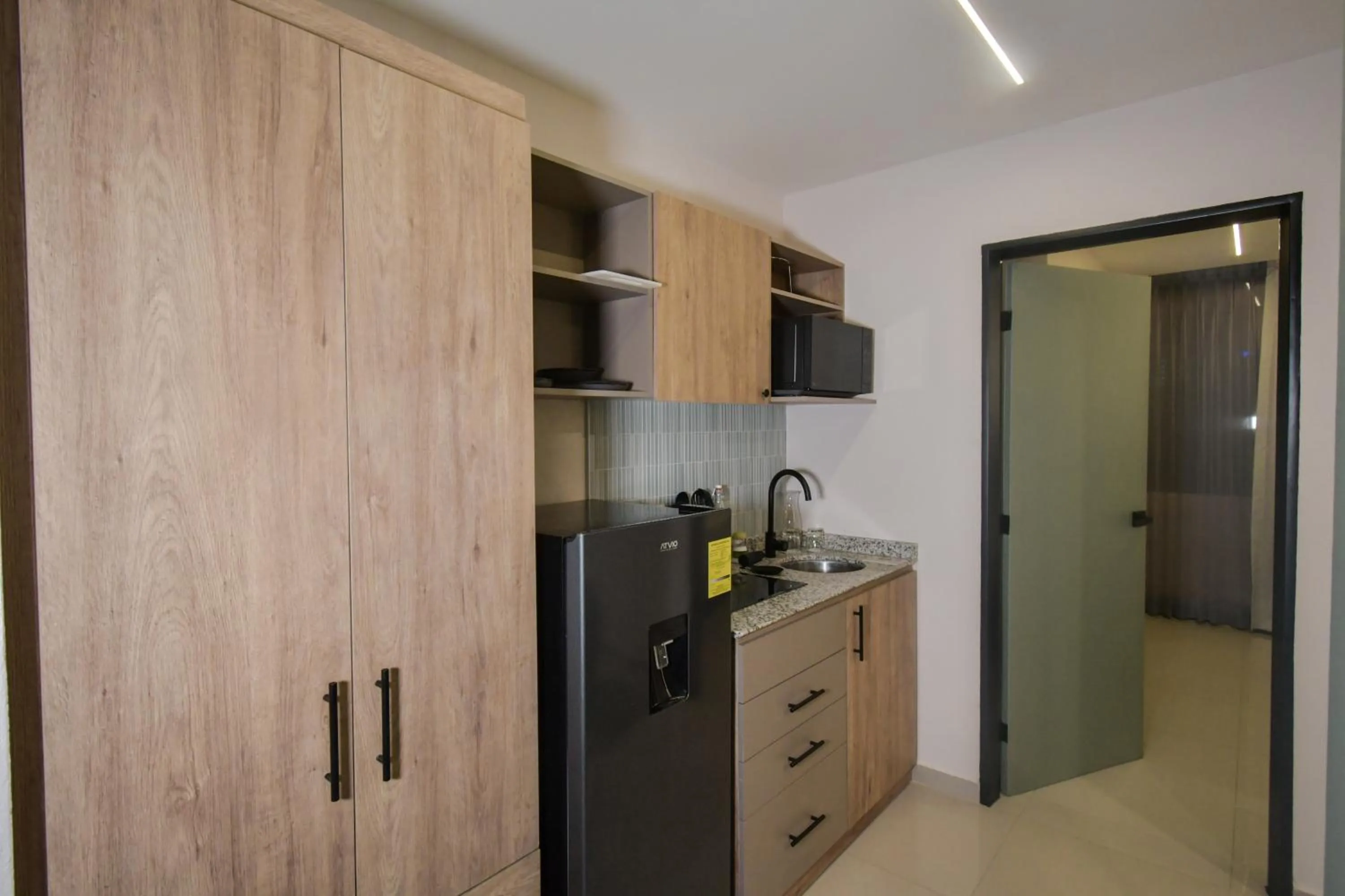 kitchen in Expo Satelite 2750 Hotel & Suites