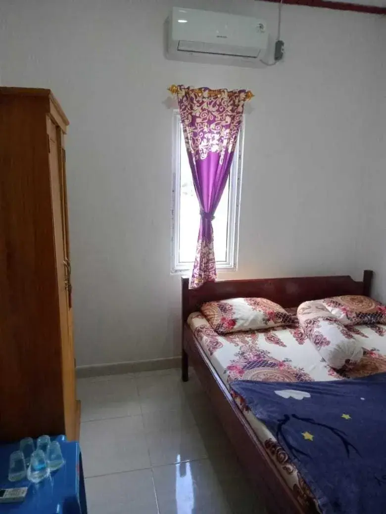 Deluxe Double Room in Hotel O Wisma Nadira Near SPBU PT. Trijaya Pugung PENENGAHAN Deluxe Double Room in Hotel O Wisma Nadira Near SPBU PT. Trijaya Pugung PENENGAHAN