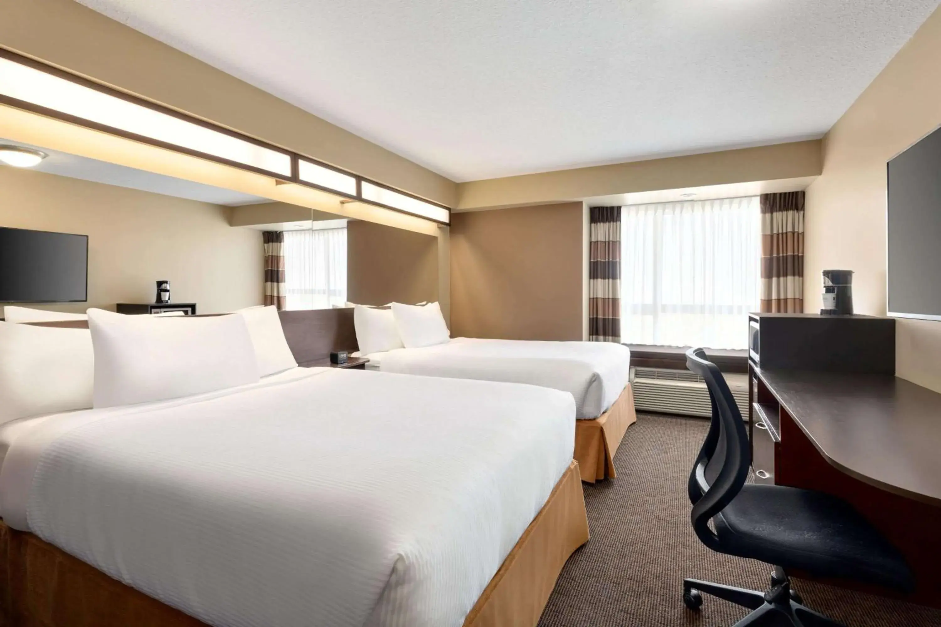 Deluxe Queen Room with Two Queen Beds - Non-Smoking in Microtel Inn and Suites by Wyndham Weyburn Deluxe Queen Room with Two Queen Beds - Non-Smoking in Microtel Inn and Suites by Wyndham Weyburn