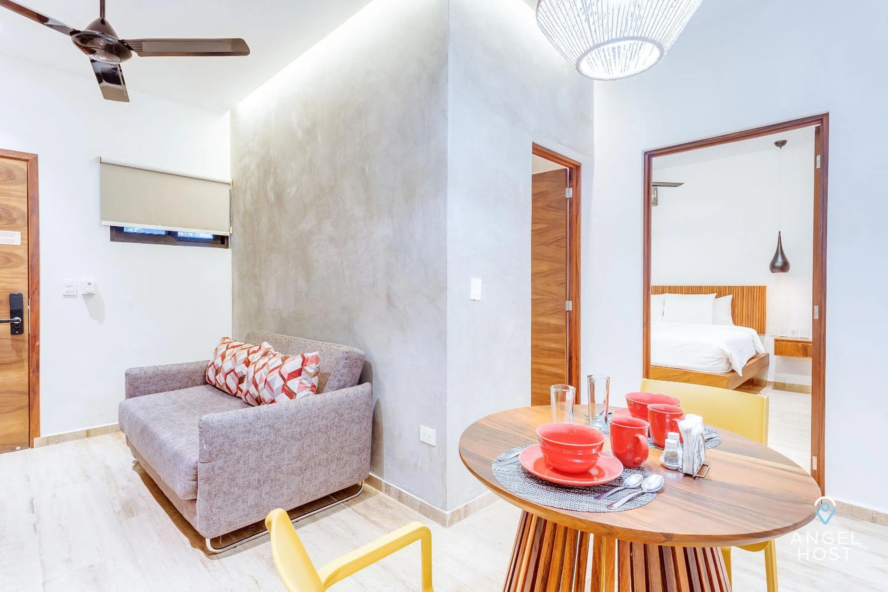 Living room, Bed in Chic Condotel with Roof Pool 10-Min Walk to Beach