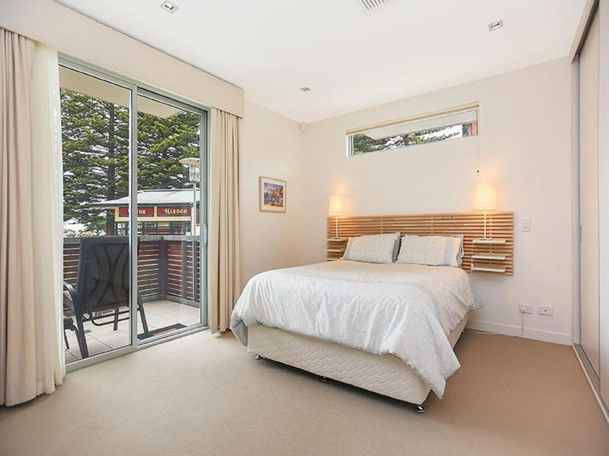 Bed in Breeze Beachfront Apartment