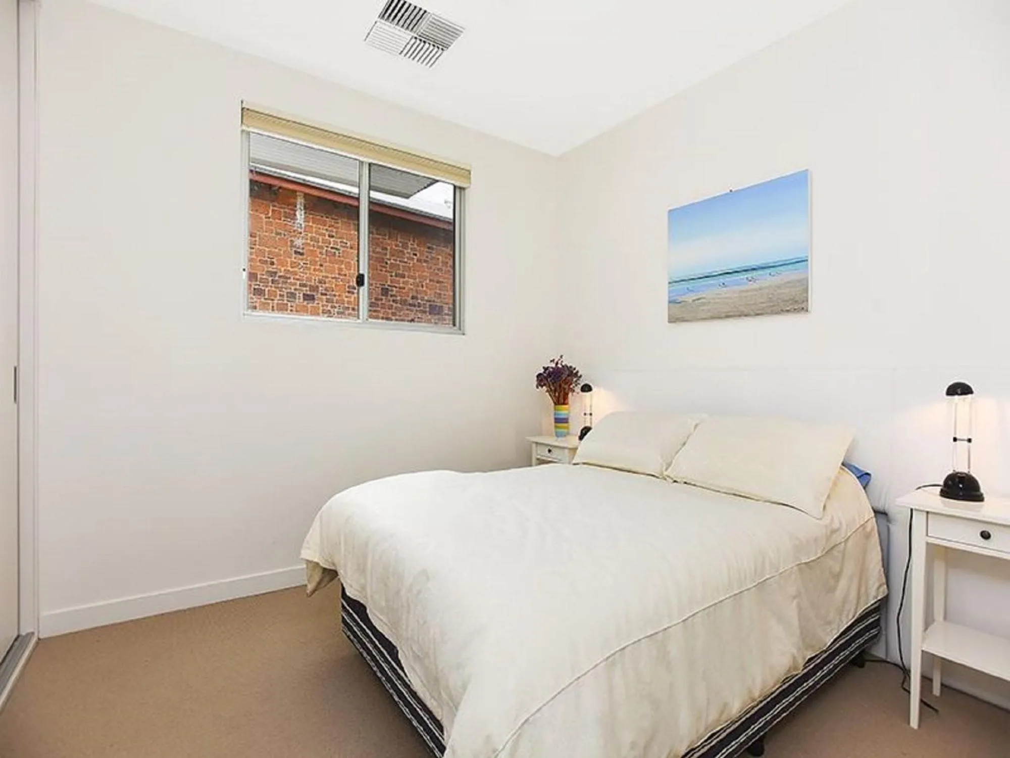 Bed in Breeze Beachfront Apartment