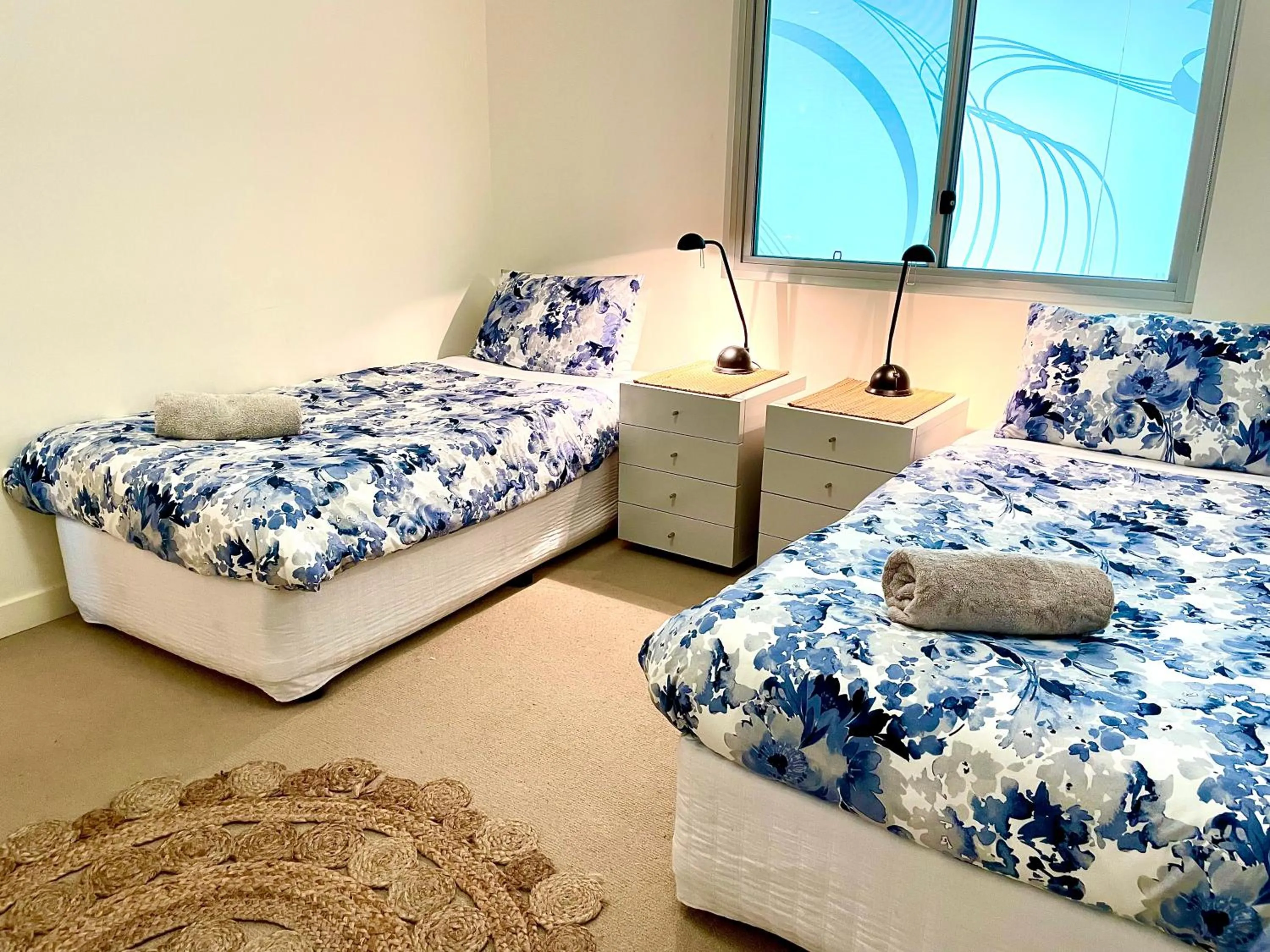Bed in Breeze Beachfront Apartment
