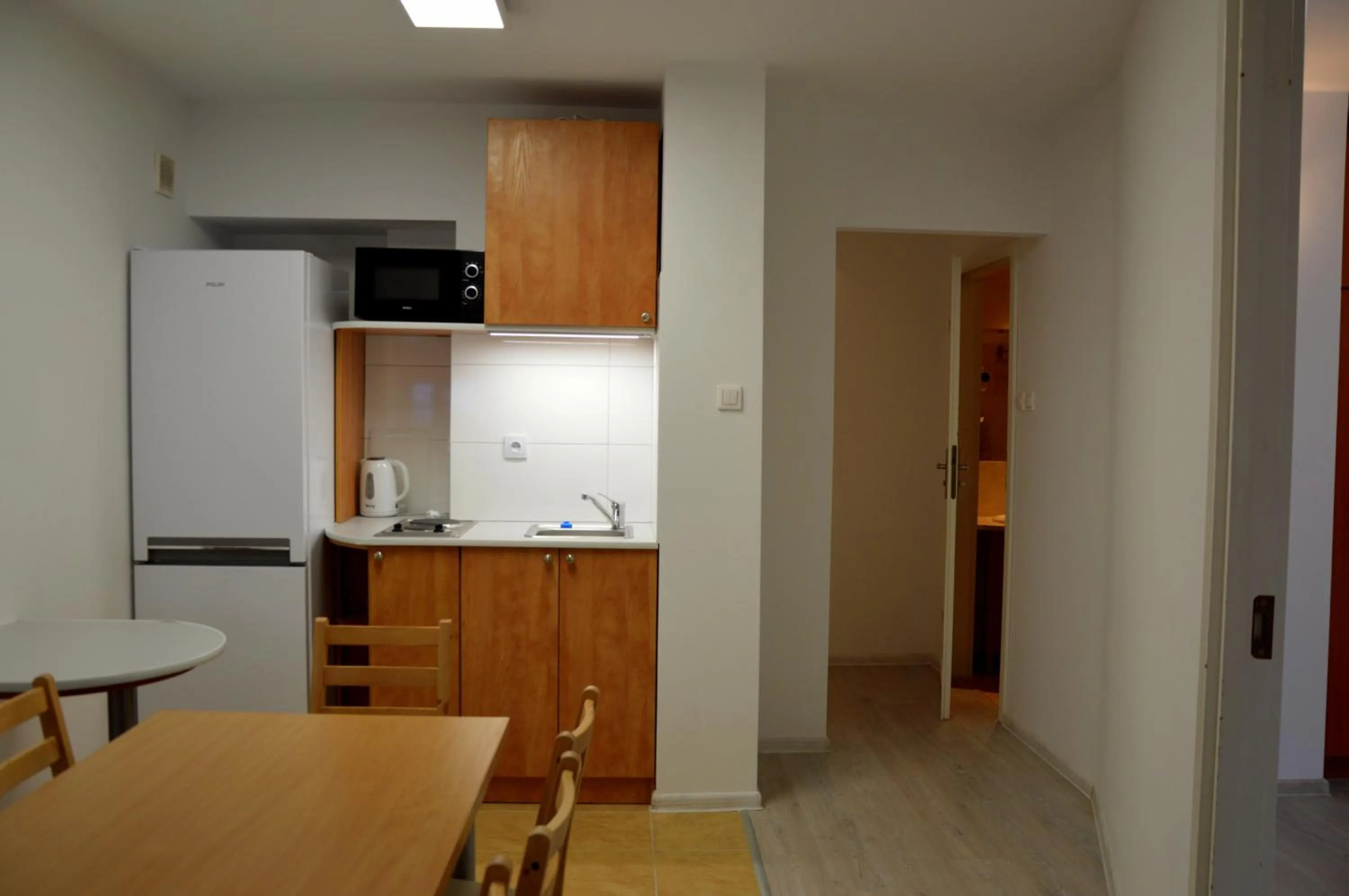 Kitchen or kitchenette in Warsaw Apartments Magnolie