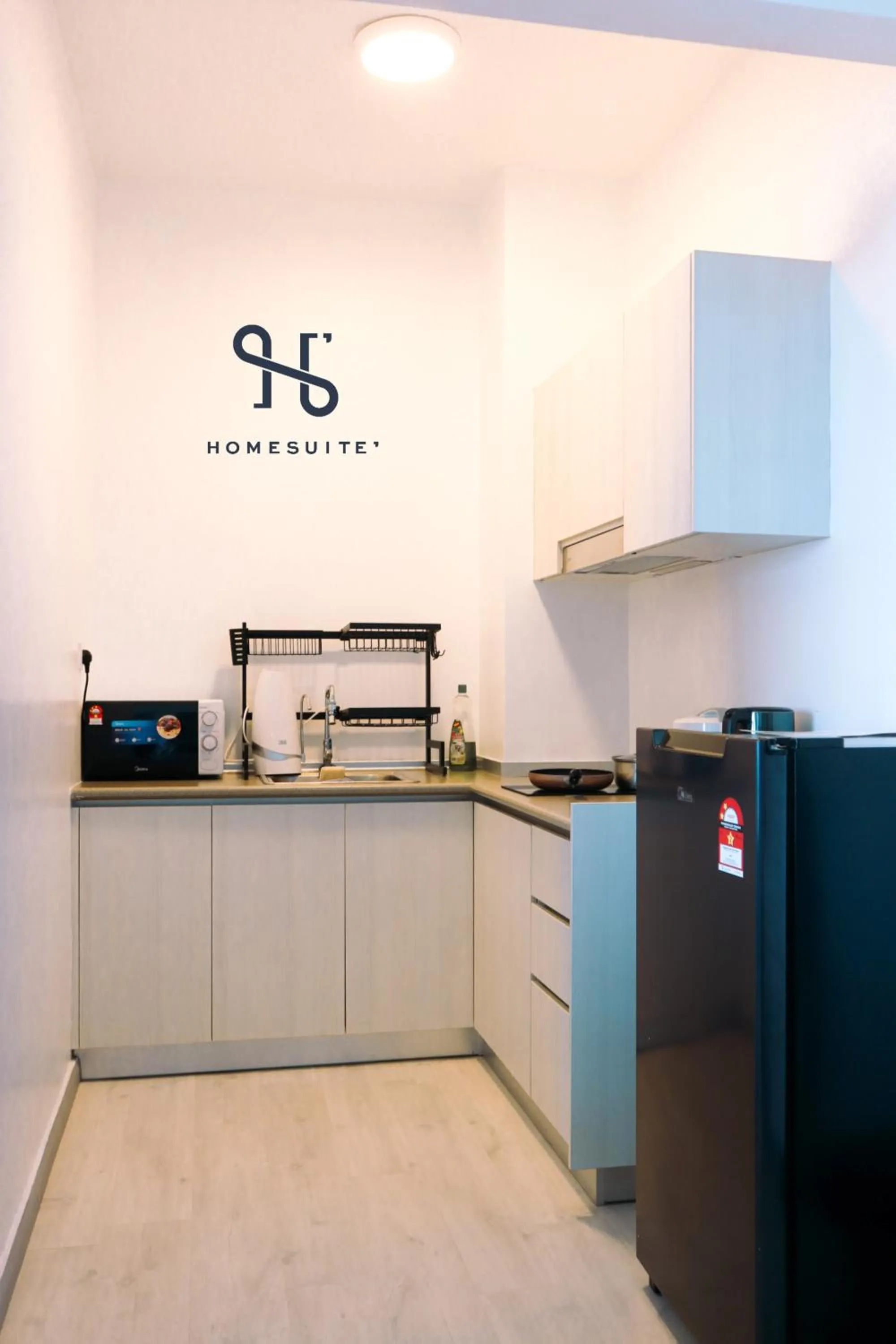 Kitchen or kitchenette in Homesuite' Home at Jesselton Quay