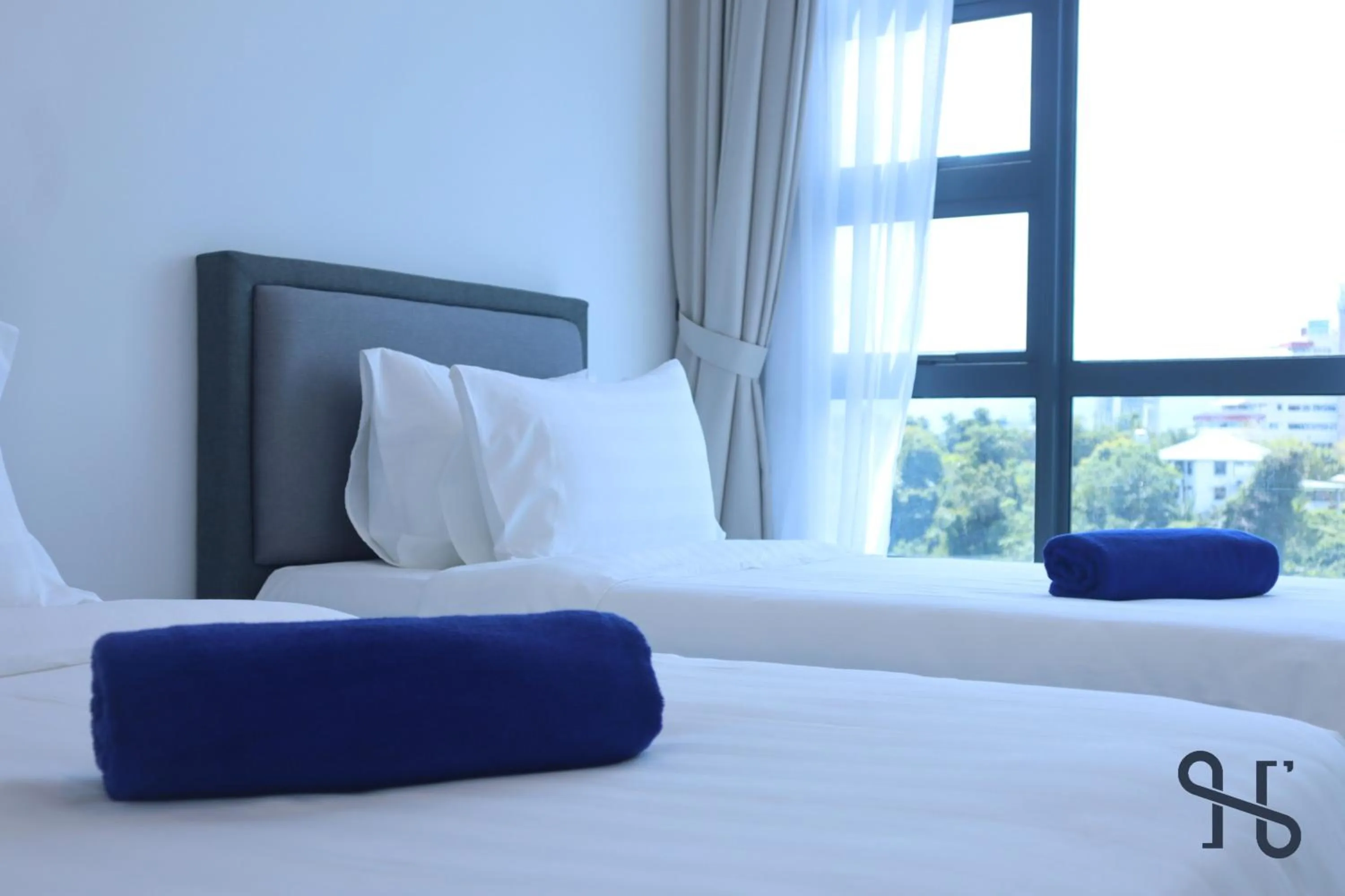 Bed in Homesuite' Home at Jesselton Quay