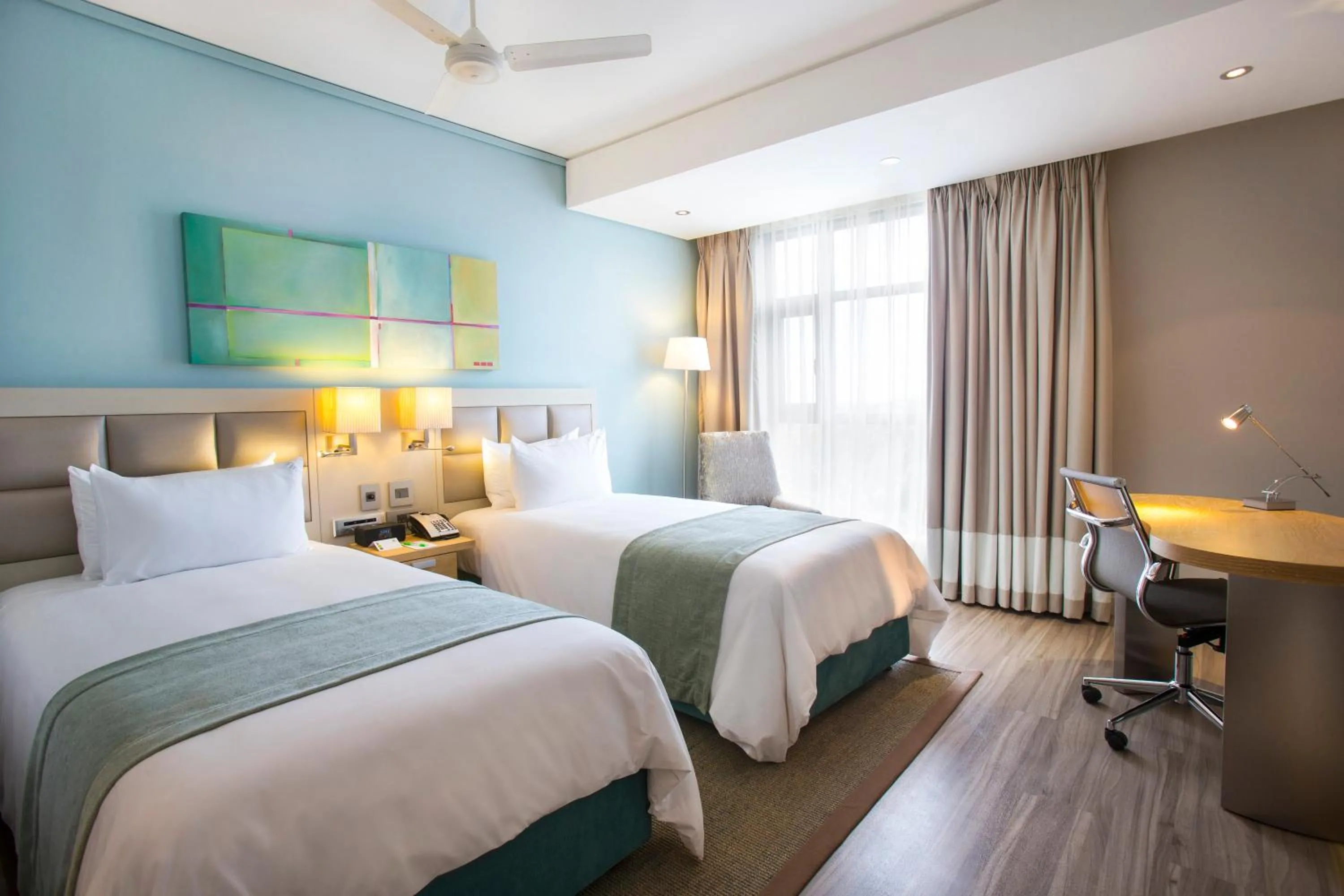 Photo of the whole room, Bed in Holiday Inn Mauritius Mon Trésor by IHG