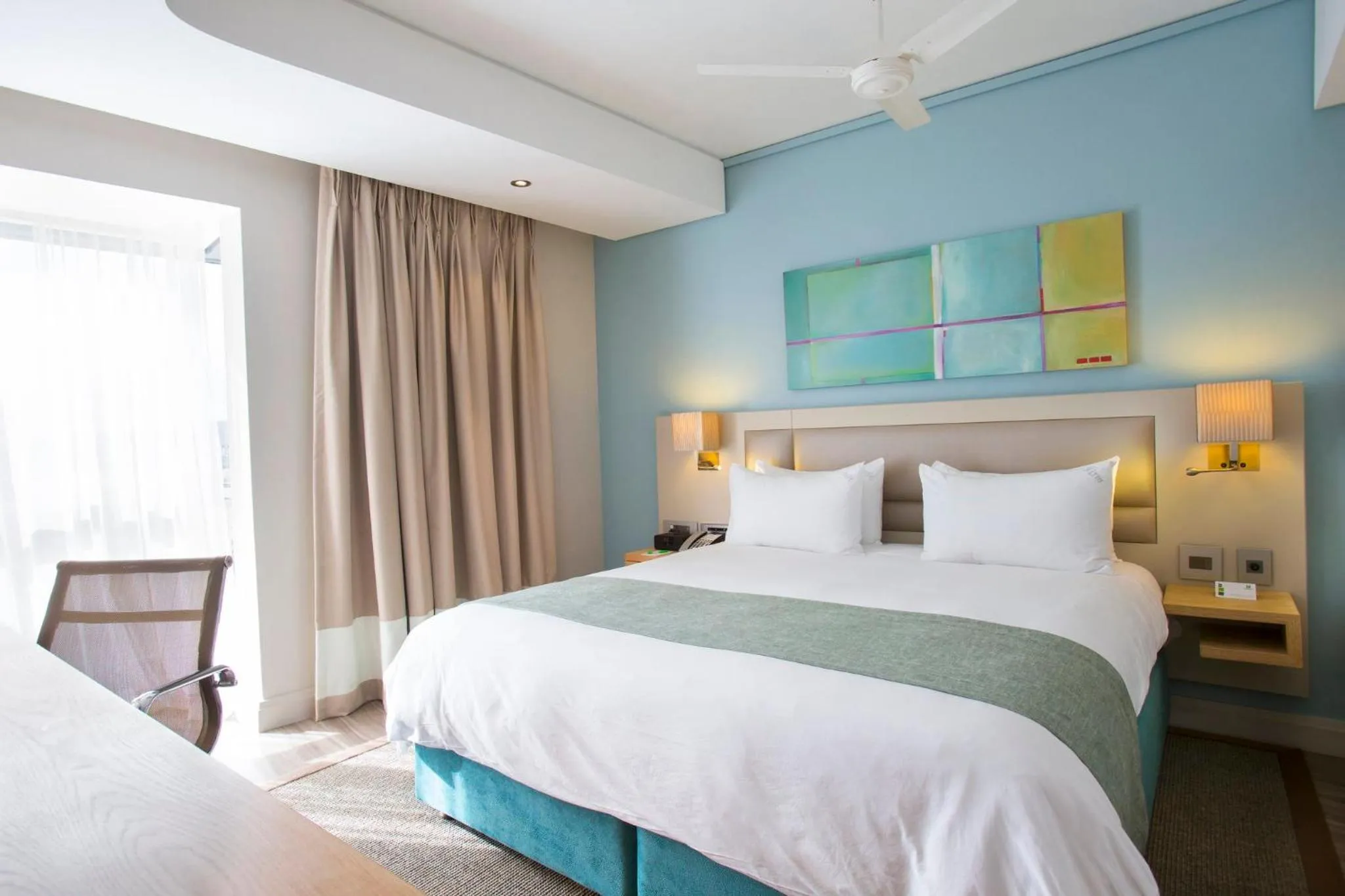 Photo of the whole room, Bed in Holiday Inn Mauritius Mon Trésor by IHG