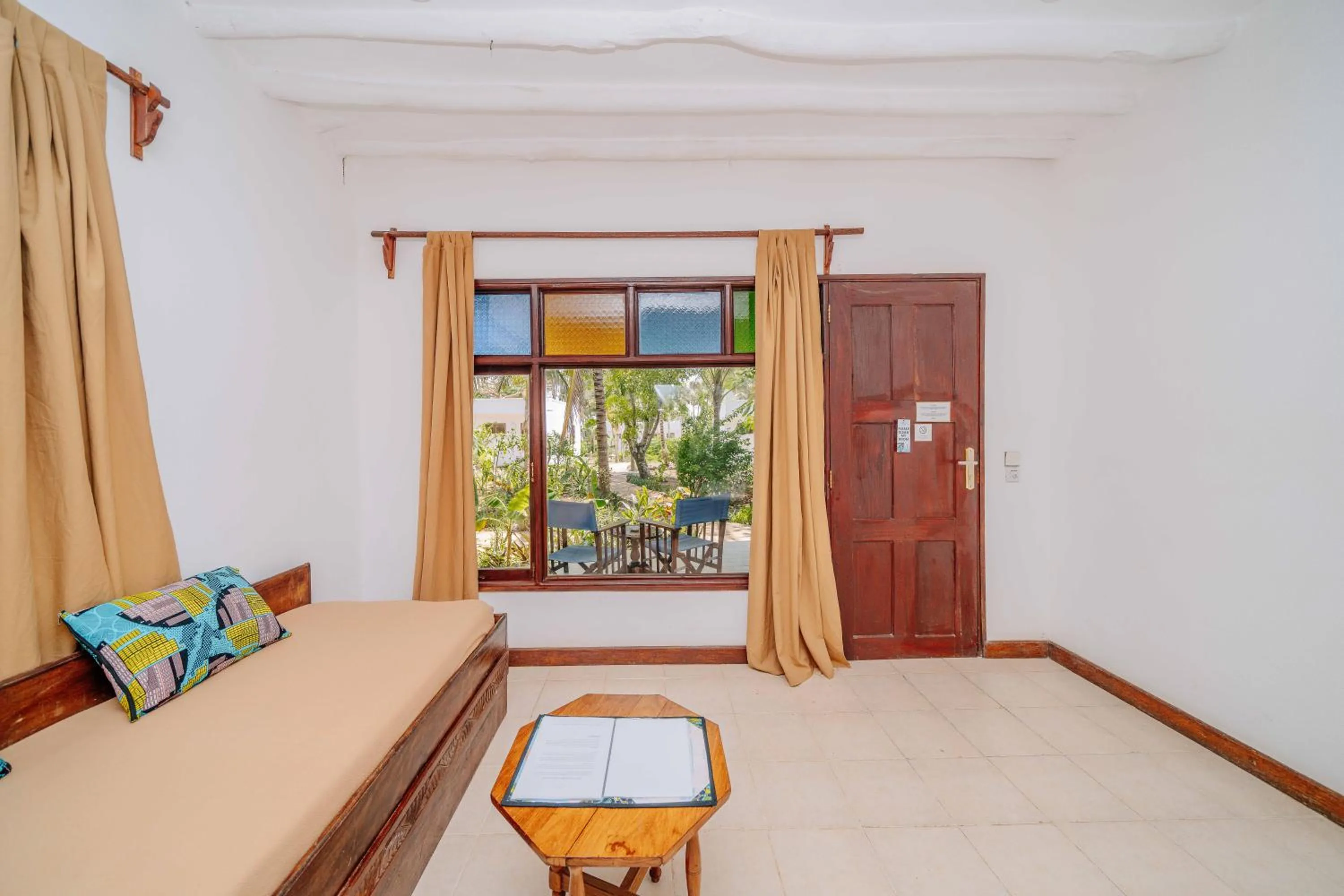Seating area, Bed in Spice Island Hotel & Resort