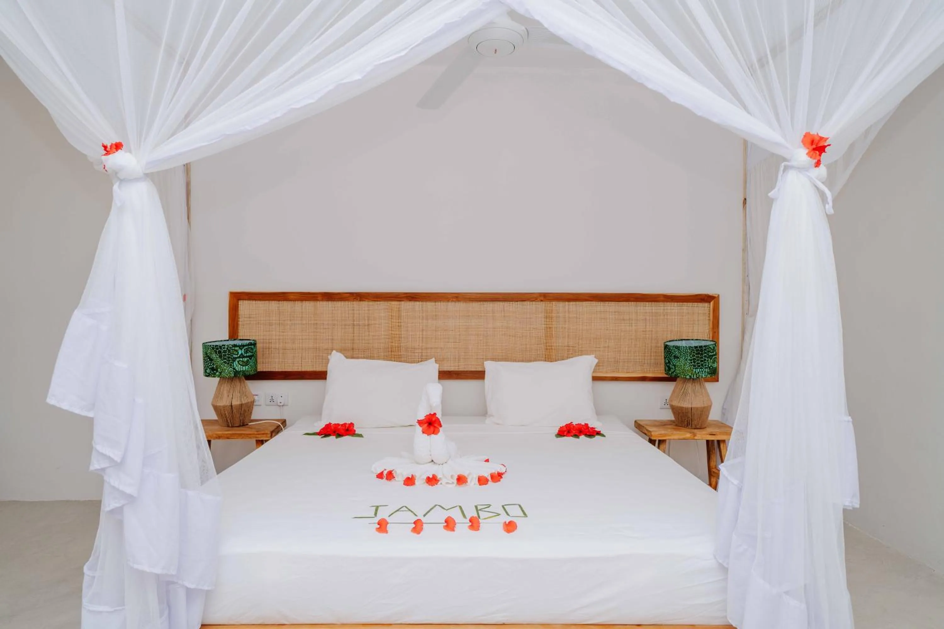 Bed in Spice Island Hotel & Resort