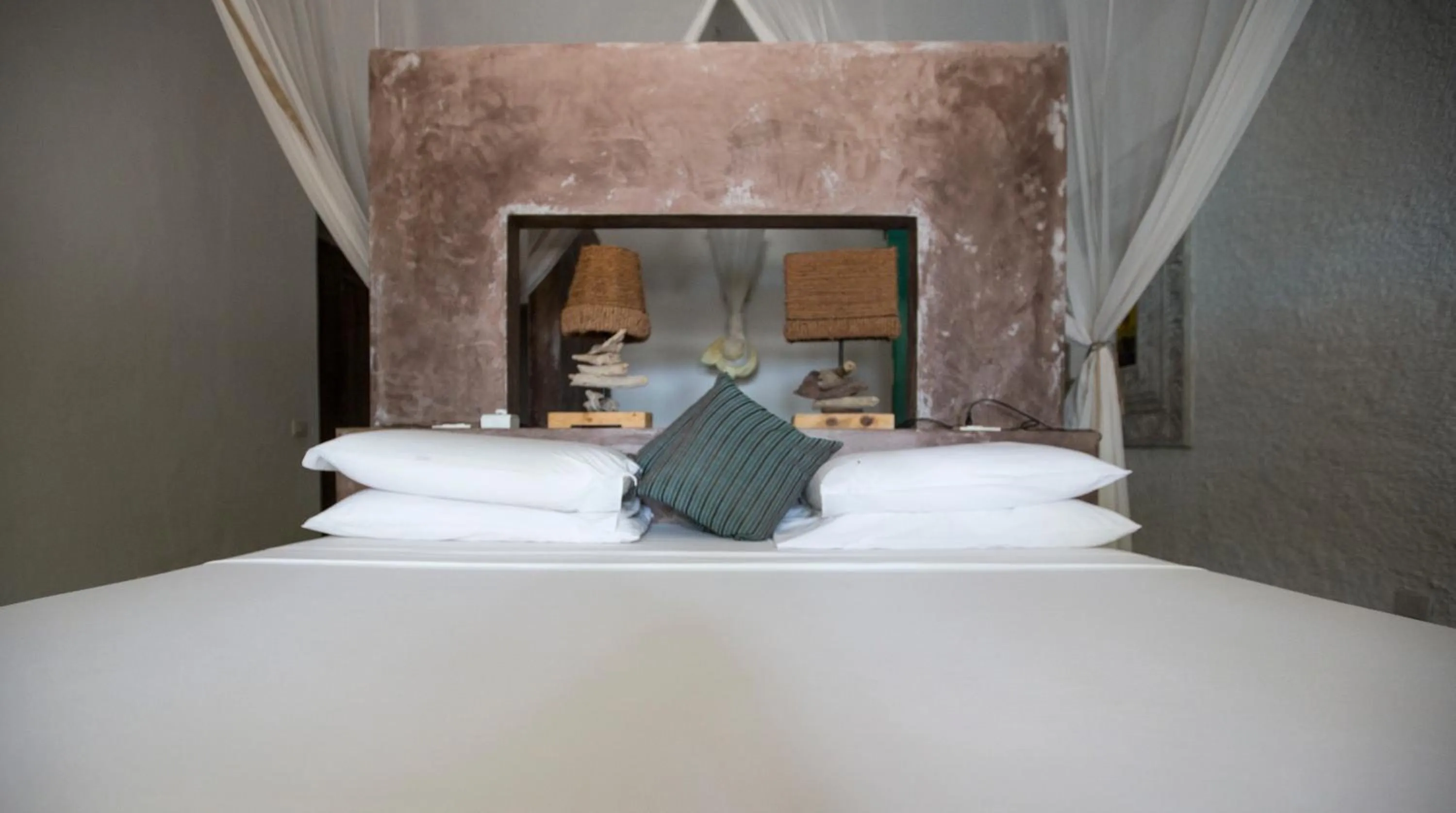 Bed in Uzuri Boutique Hotel