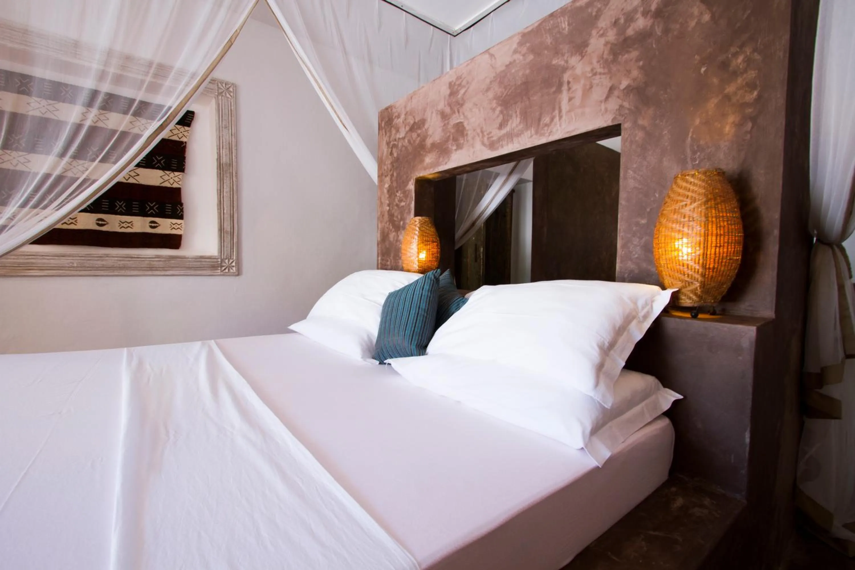 Bed in Uzuri Boutique Hotel