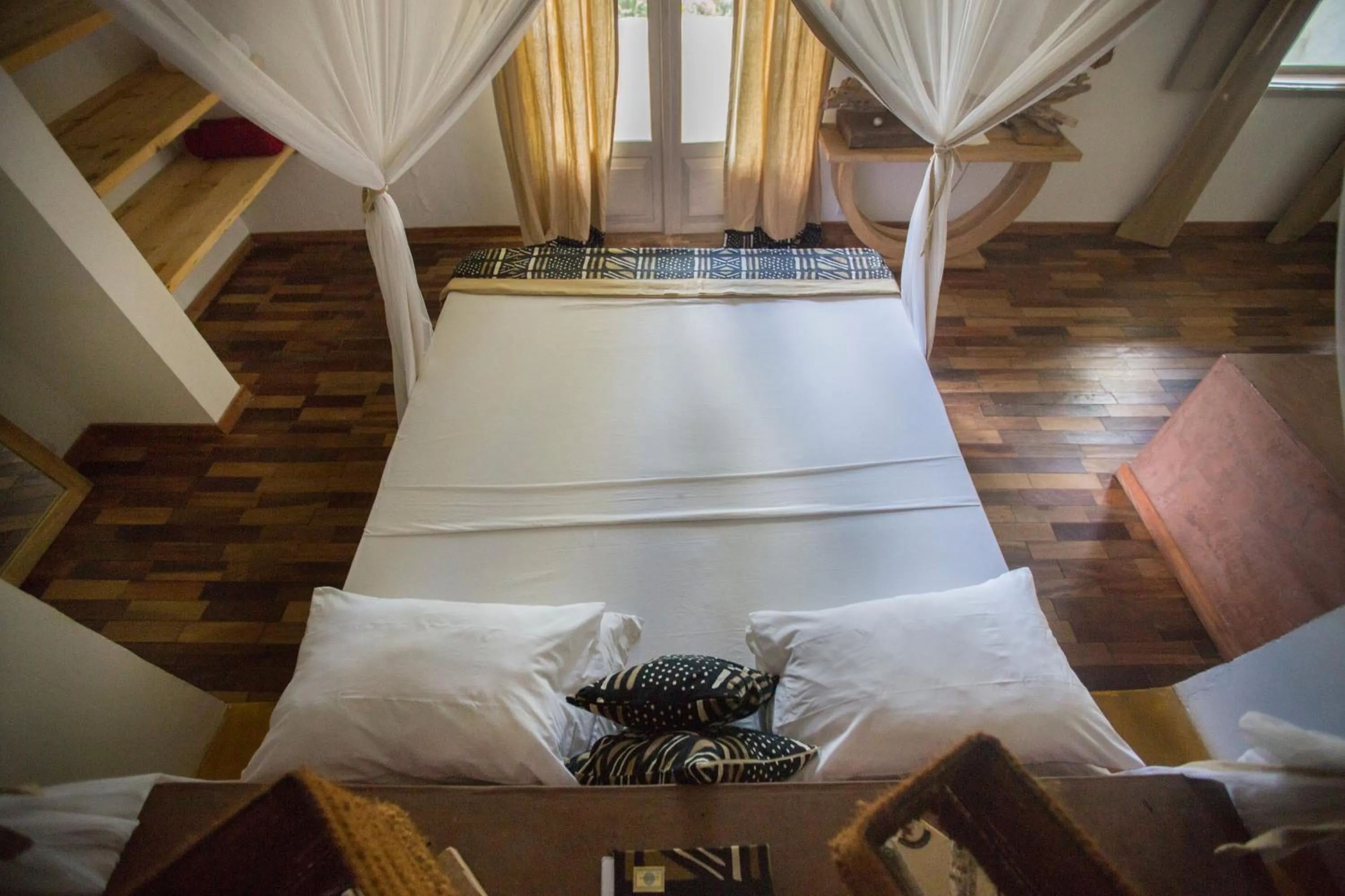 Bed in Uzuri Boutique Hotel