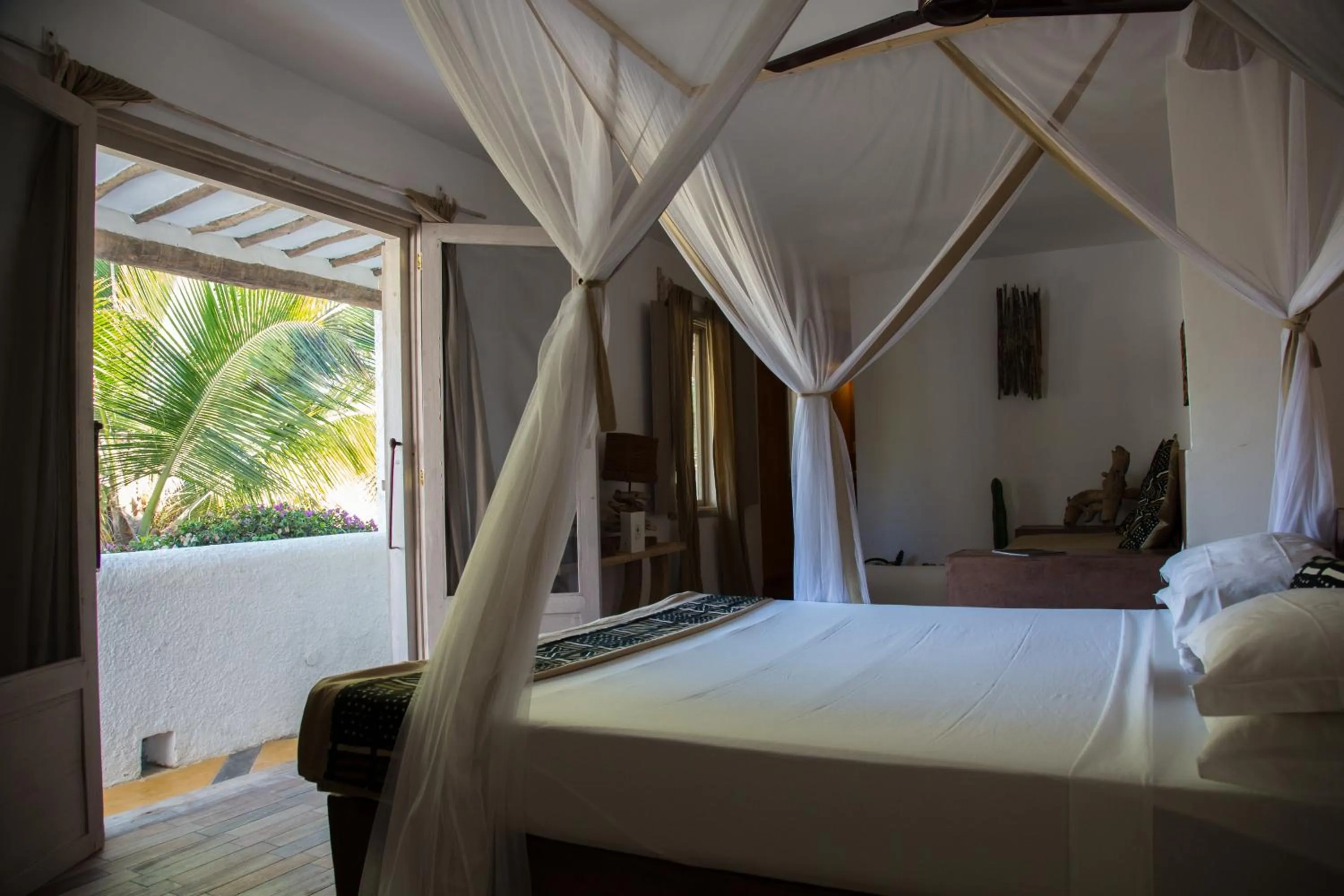 Bed in Uzuri Boutique Hotel