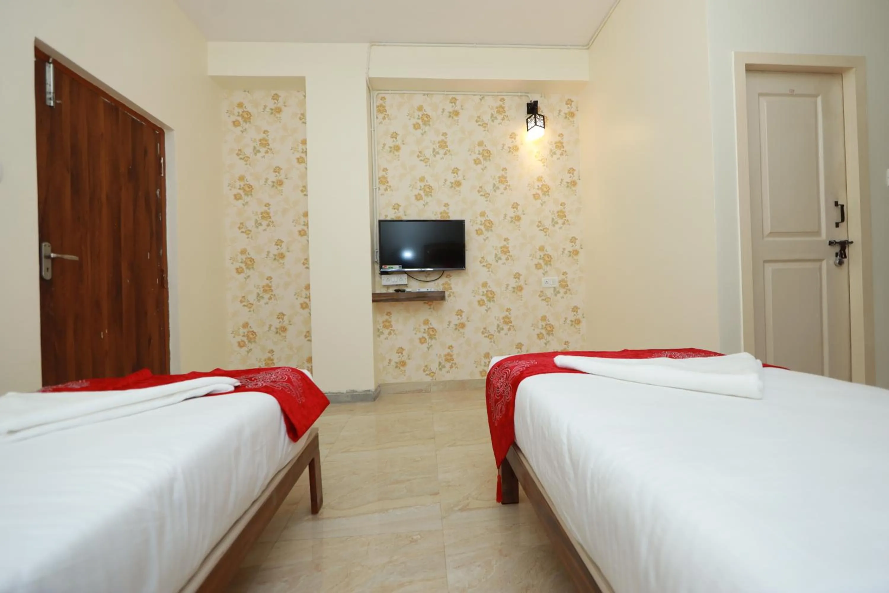 Bed in Hotel Amulya Relax Inn