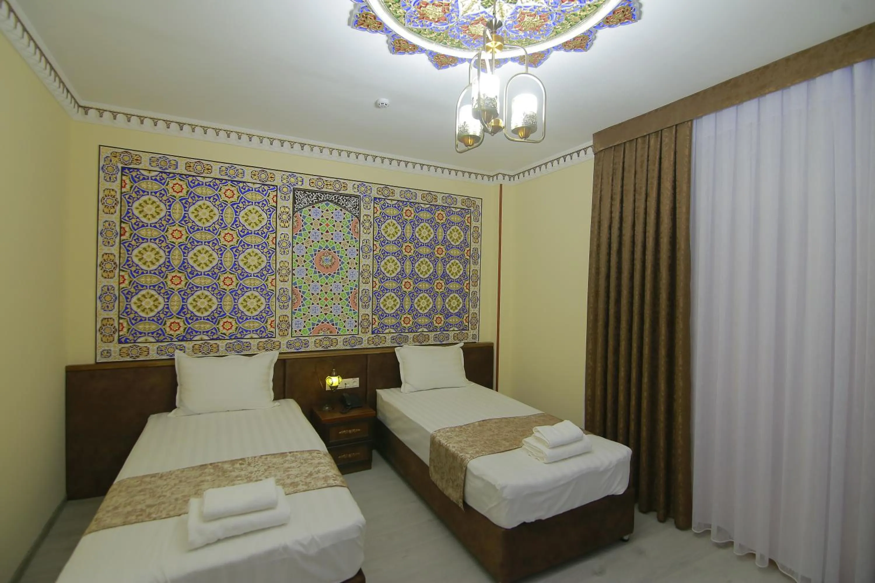 Bed in Sahar Boutique Hotel