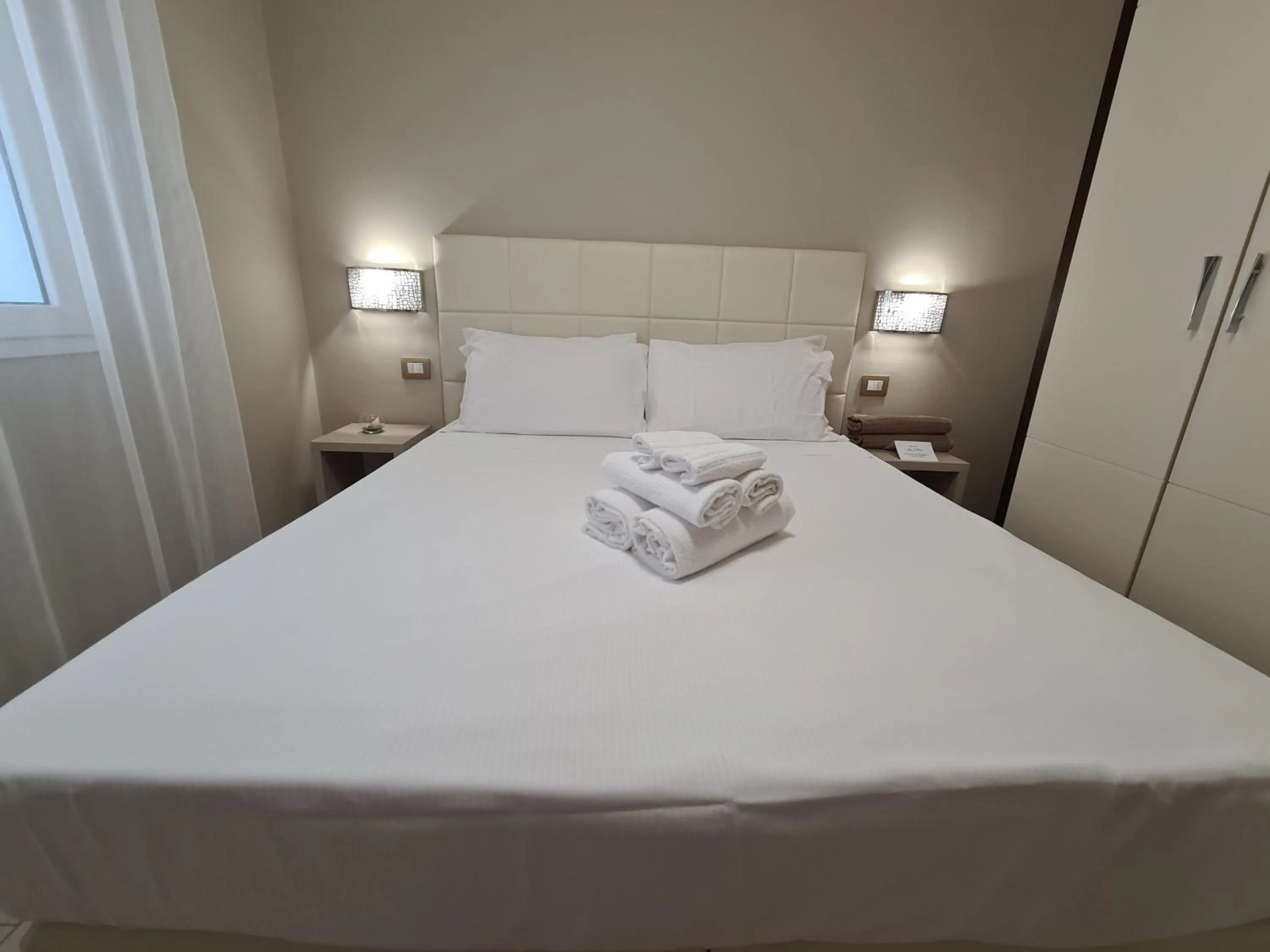 Bed in Nero D'Avorio Apartments