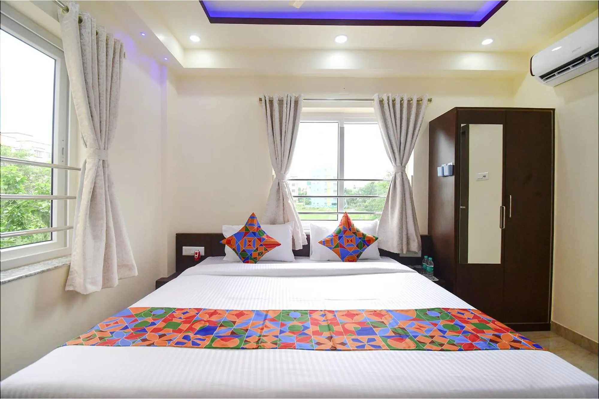 Bed in FabHotel Anchorage Inn - Nr Axis Mall
