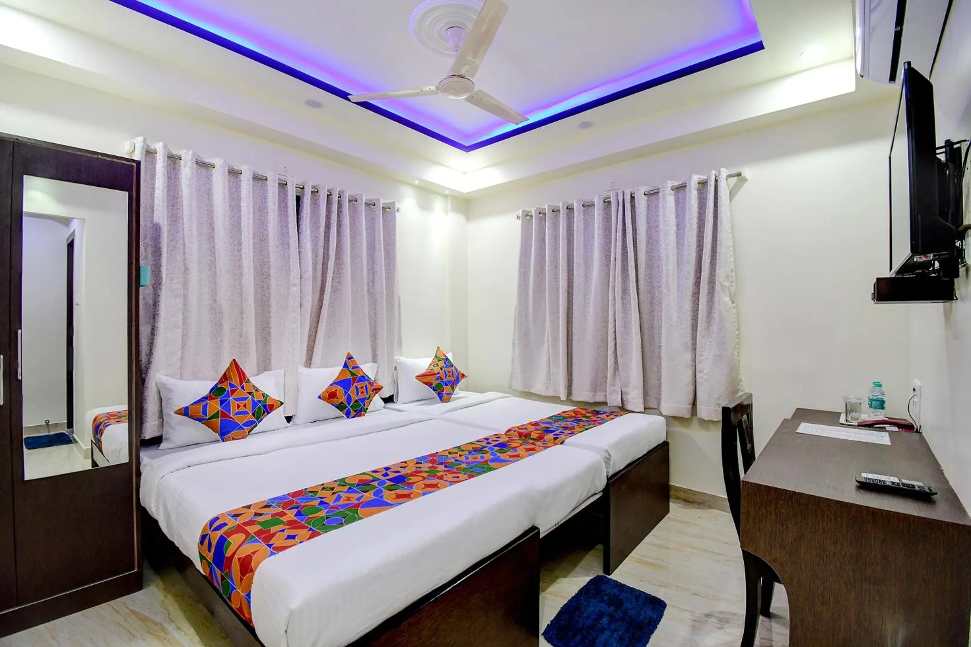 Bed in FabHotel Anchorage Inn - Nr Axis Mall