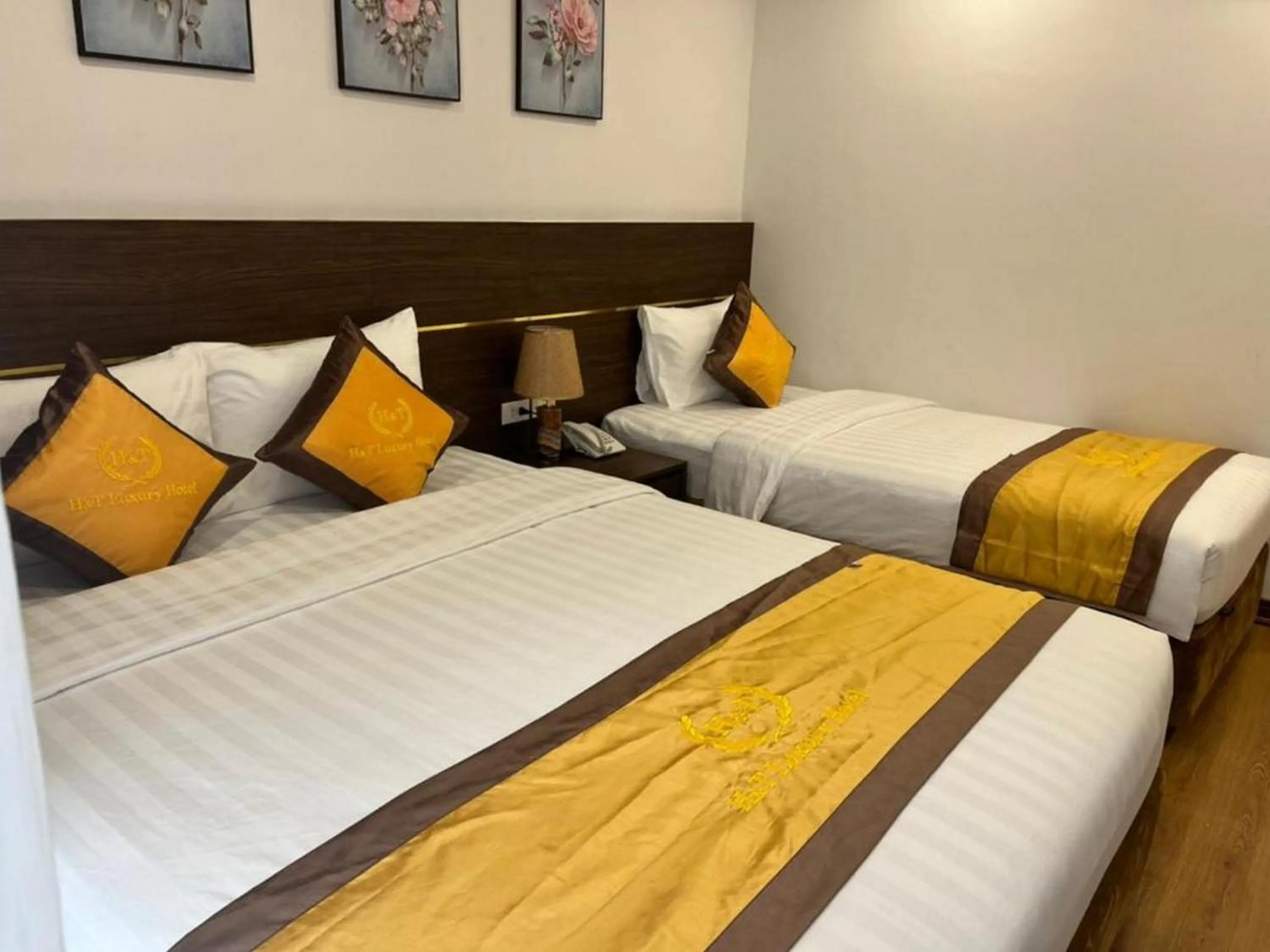 Bed in H&T Luxury Hotel