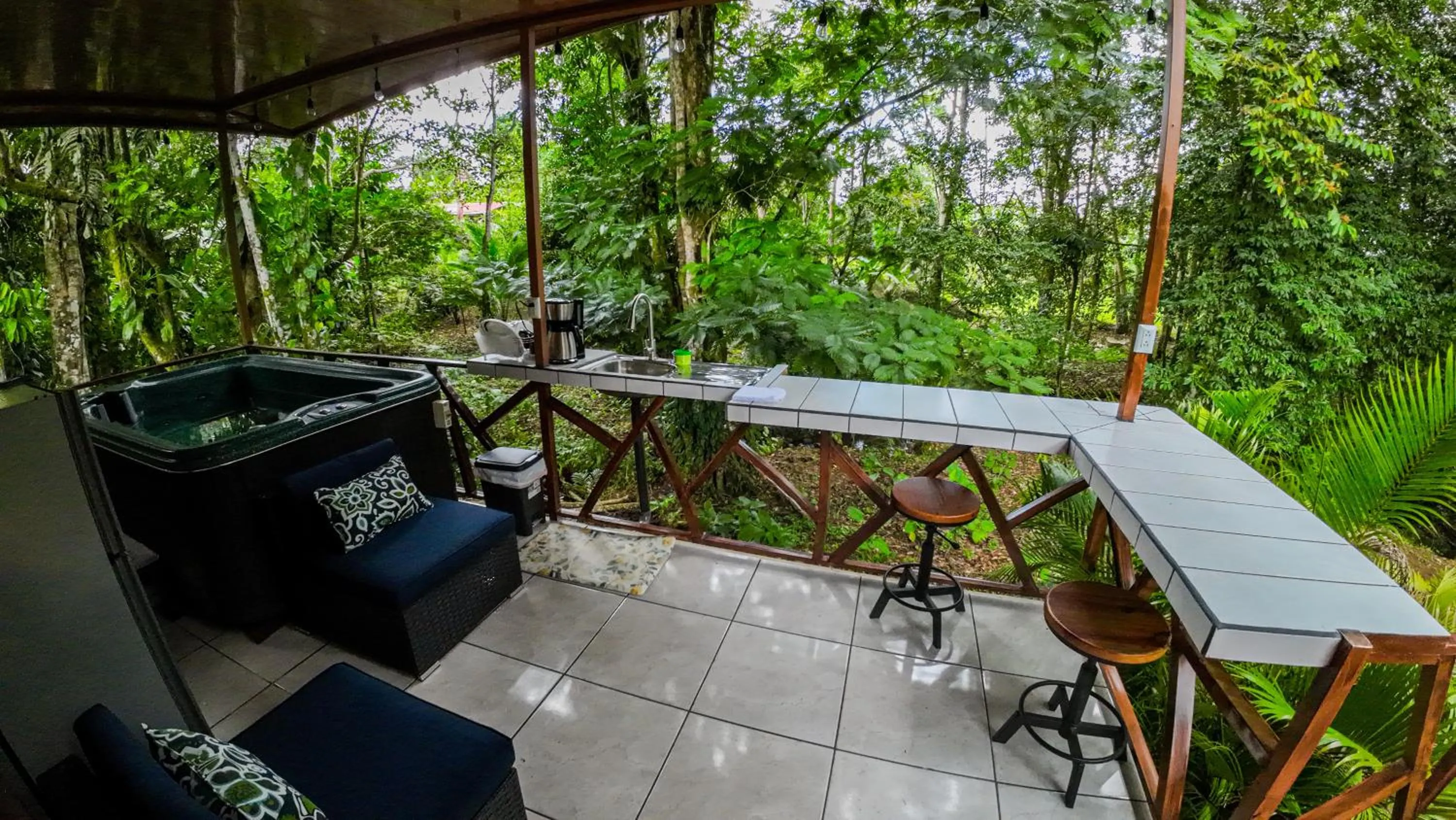 Seating area in Bungalows Las Iguanas Arenal Volcano