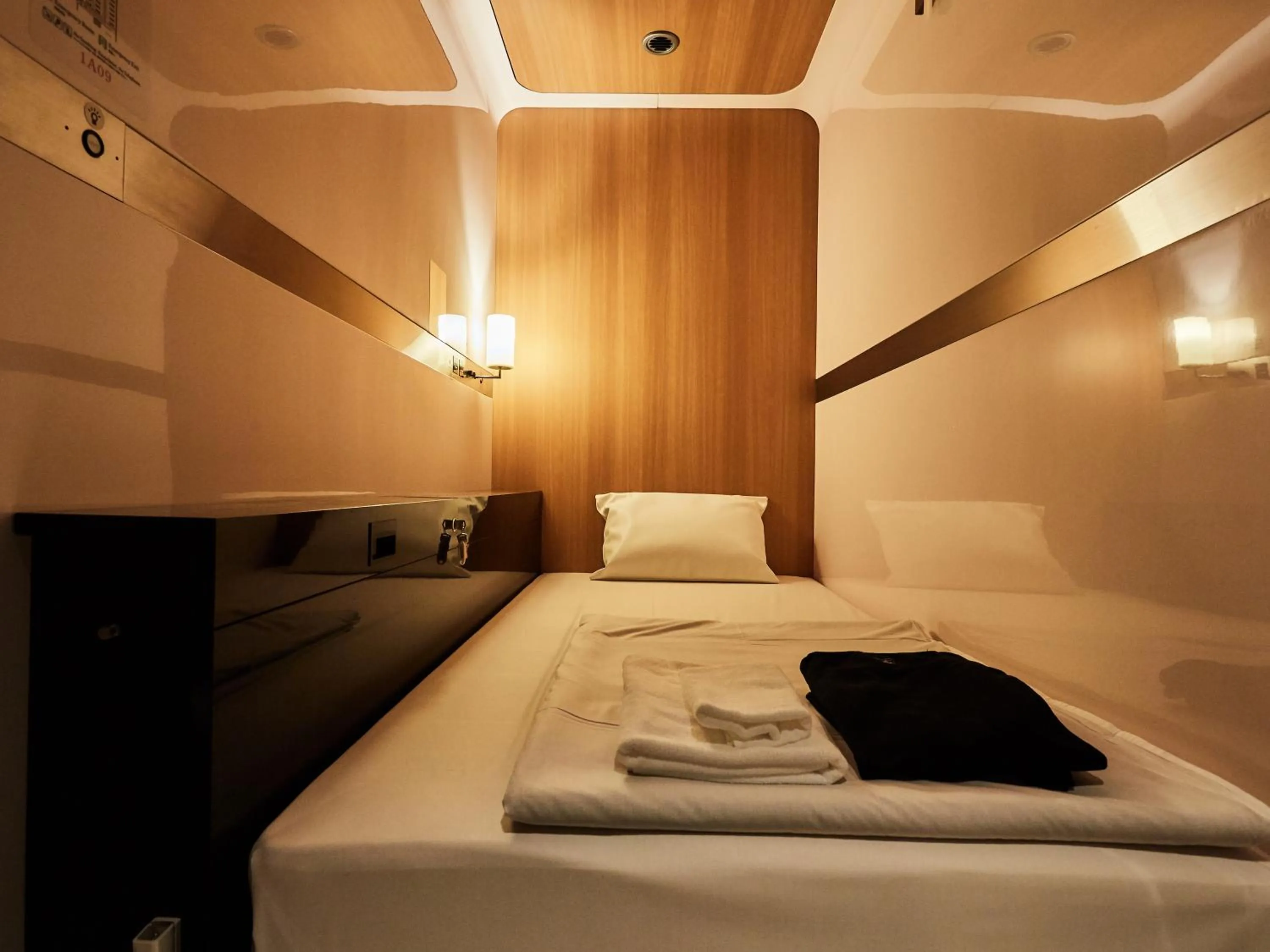 Photo of the whole room, Bed in First Cabin Nishi Umeda