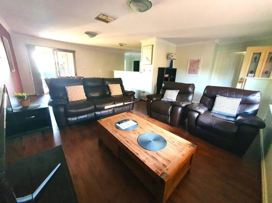 Living room in Adorable-secure 3 bedroom holiday home with Pool around the corner from The Miners Rest.