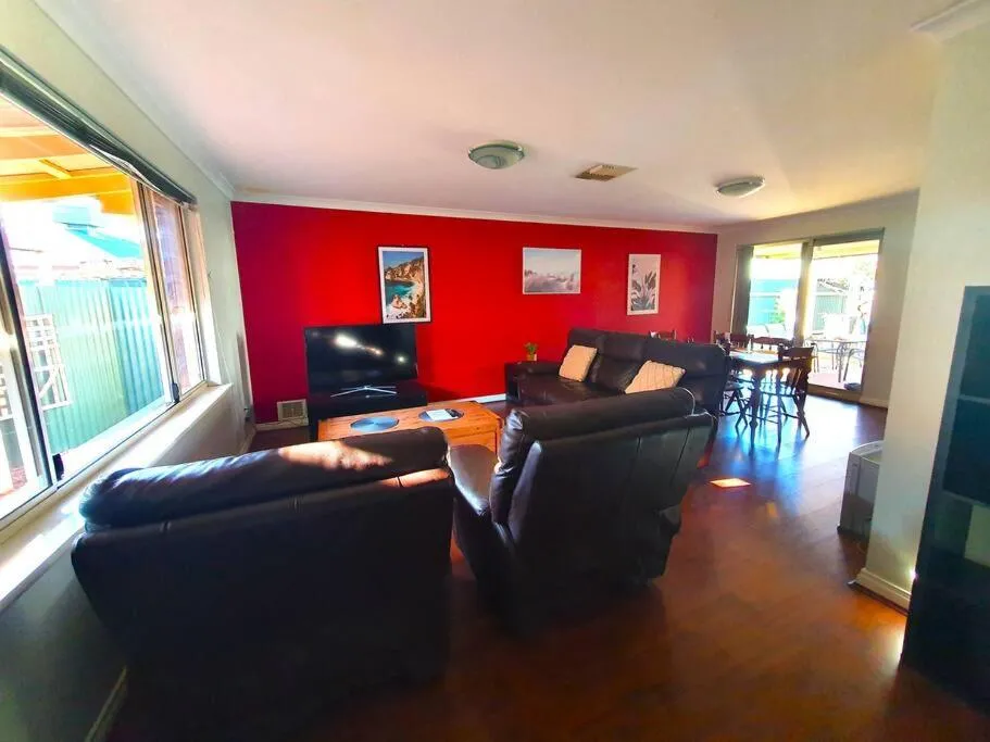 Seating area in Adorable-secure 3 bedroom holiday home with Pool around the corner from The Miners Rest.