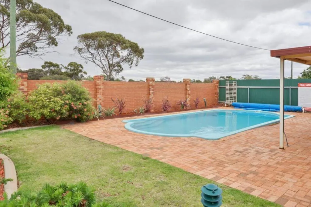 Swimming pool in Adorable-secure 3 bedroom holiday home with Pool around the corner from The Miners Rest.