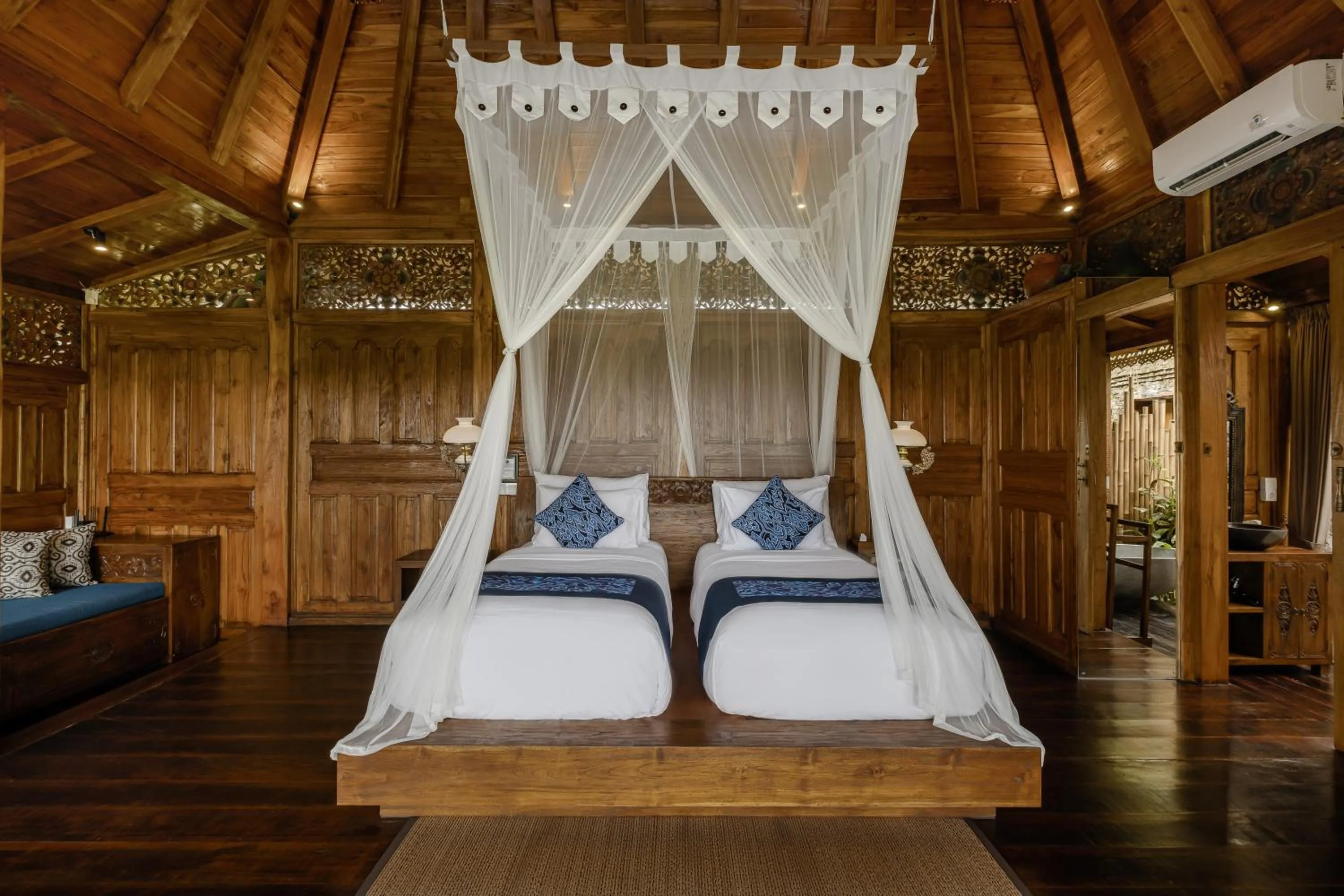 Bed in Airsania Ubud Antique Villas