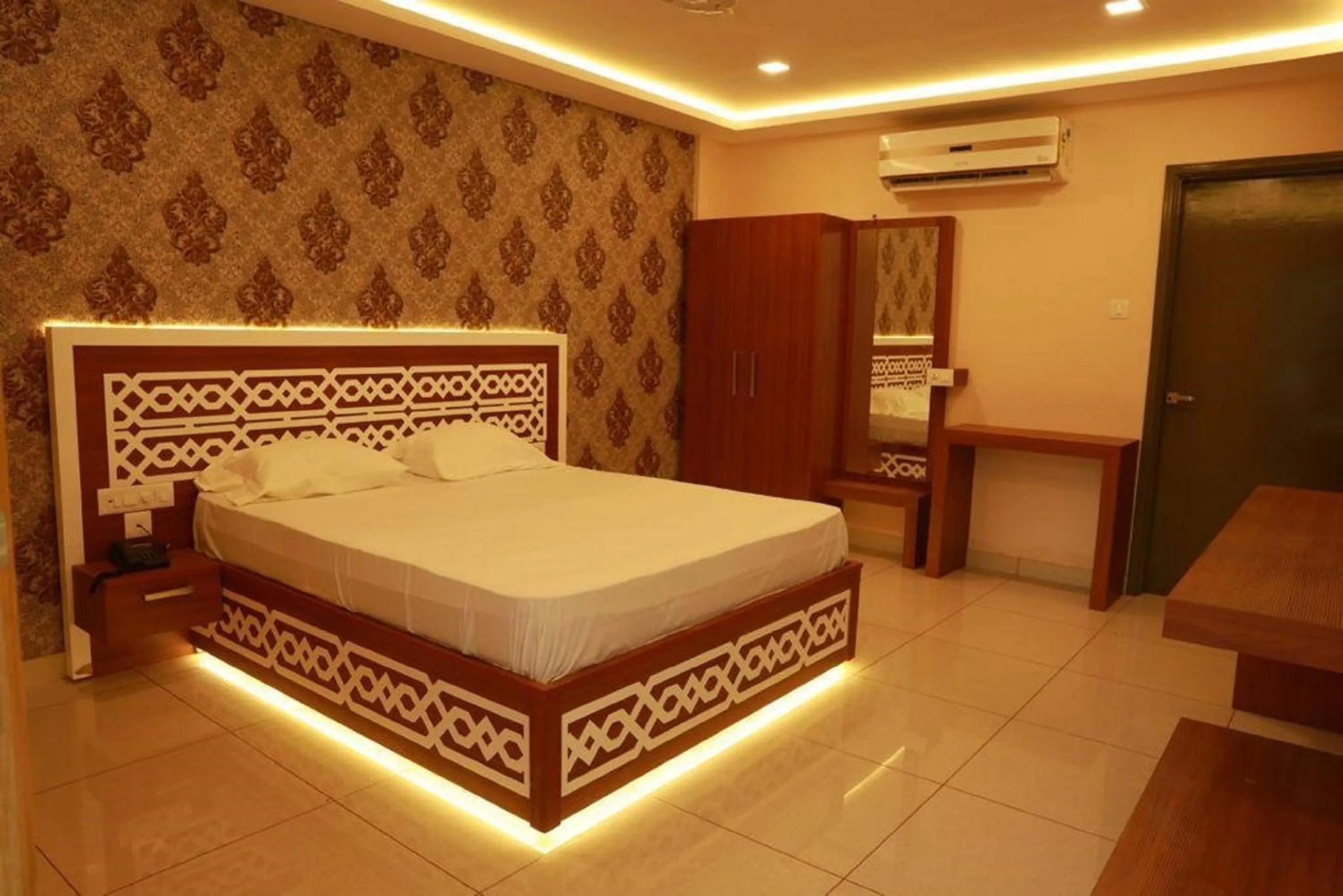 Bed in Emerald Royal Residency
