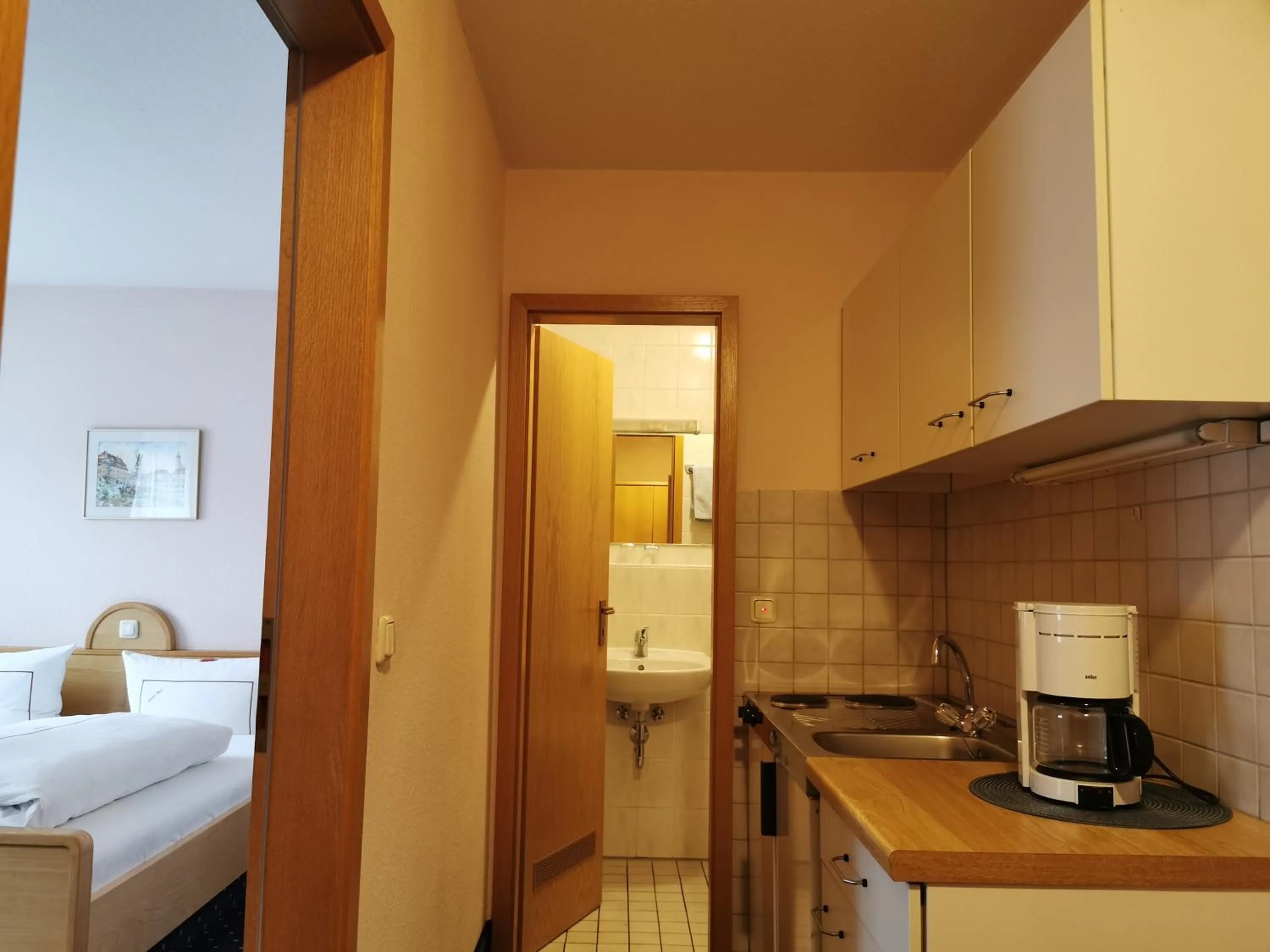 Kitchen or kitchenette, Bed in Hotel Ebner